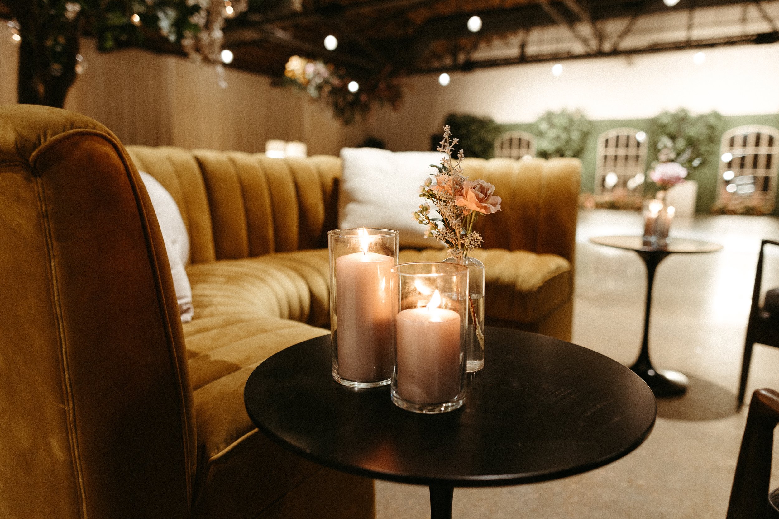 1920s and Great Gatsby inspired tablescapes are highlighted by gorgeous gold candlesticks, blush tapers, and taupe and bronze votives. Designed with floral hues of terra cotta, mauve, and dusty rose. Designed by Rosemary and Finch in Nashville, TN.