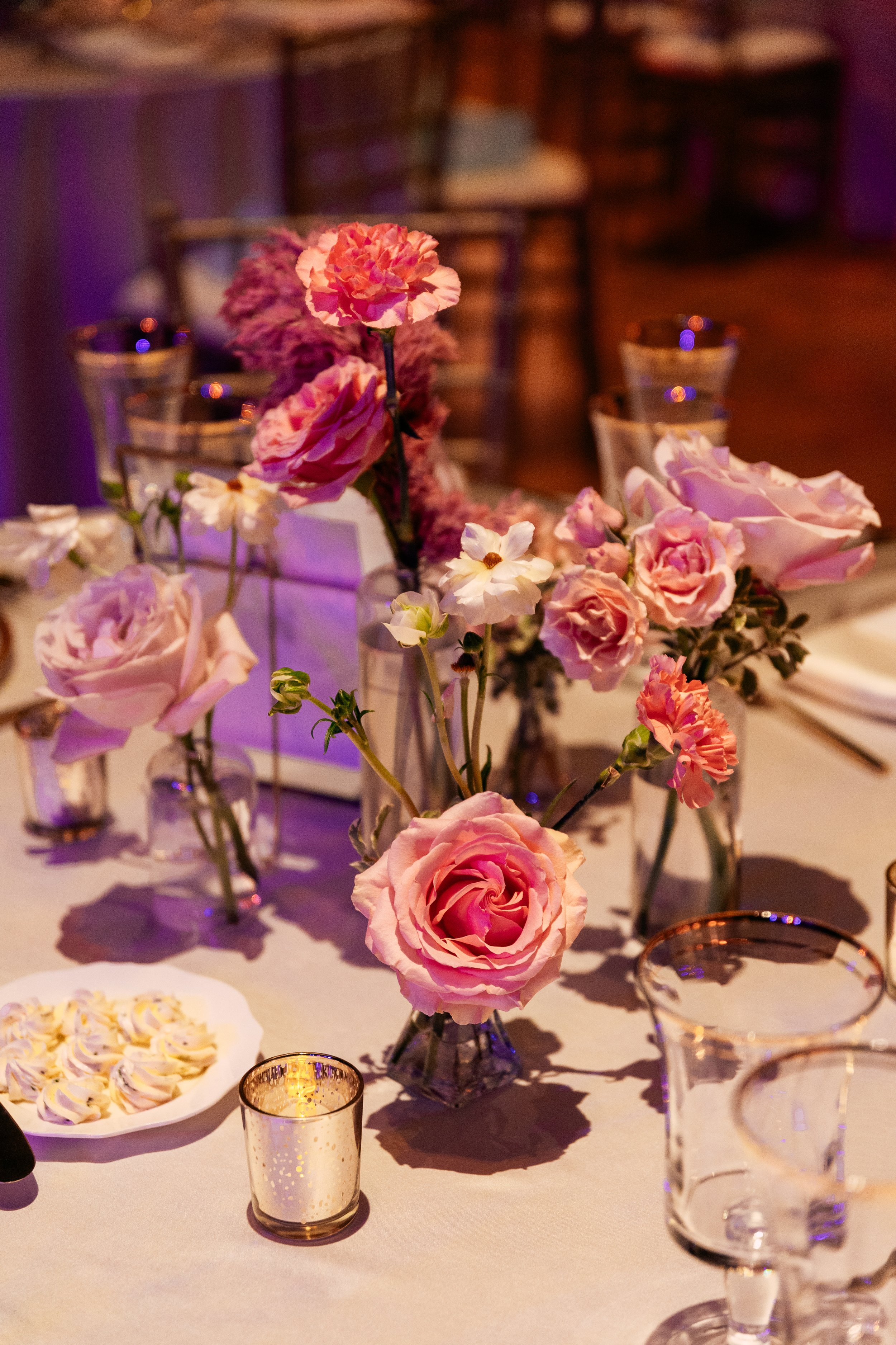 Modern and colorful centerpieces create a lively space for the TPAC Gala in Nashville, TN. Color-blocked floral hues of pink, red, yellow, blue comprised of roses, hydrangeas, tulips, ranunculus, pampas grass, carnations, and sweet peas. Designed by