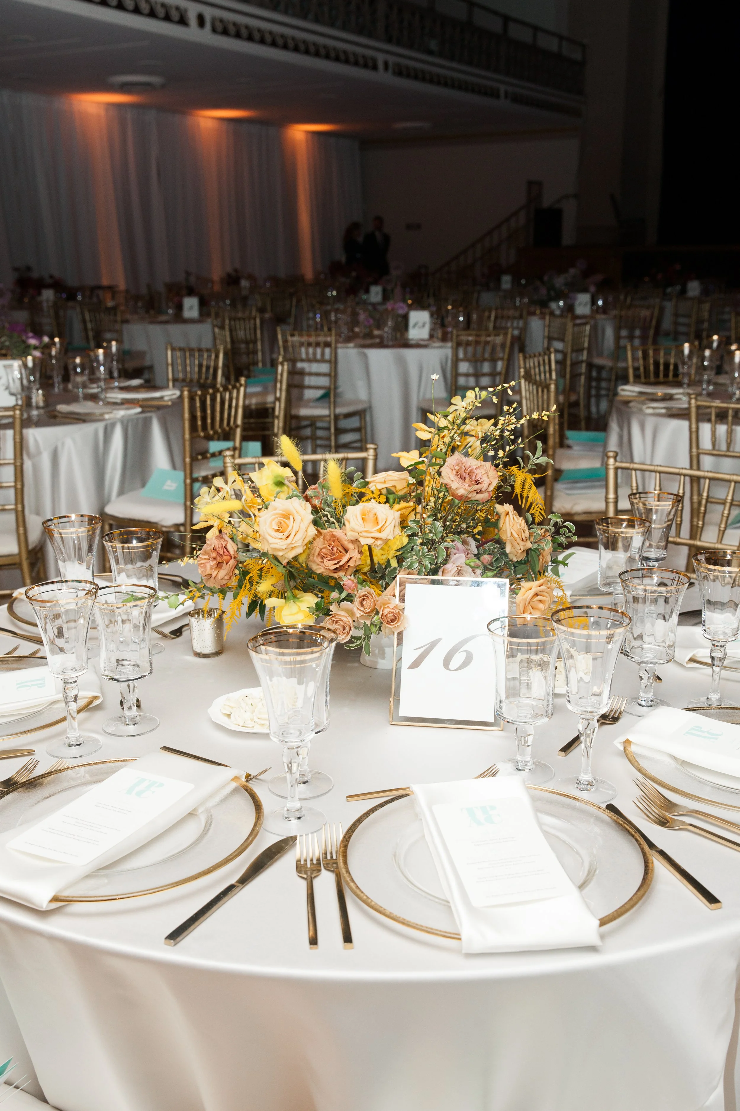Modern and colorful centerpieces create a lively space for the TPAC Gala in Nashville, TN. Color-blocked floral hues of pink, red, yellow, blue comprised of roses, hydrangeas, tulips, ranunculus, pampas grass, carnations, and sweet peas. Designed by