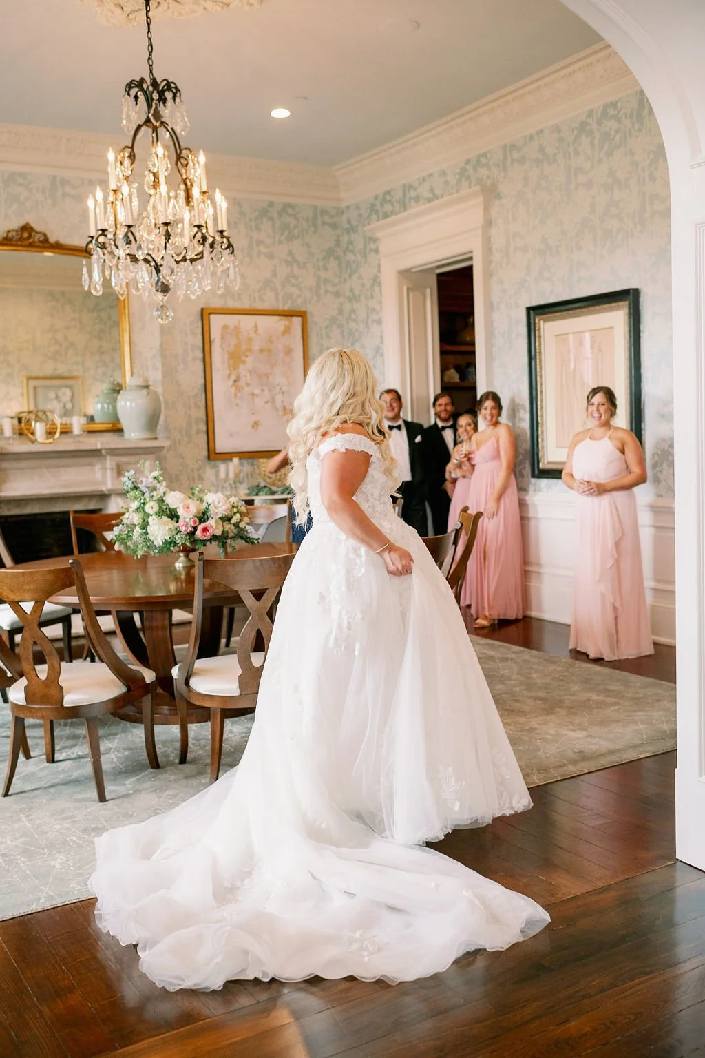 This private estate wedding creates a garden-inspired setting in hues of ivory, pink, blush, and French blue composed of petal heavy roses, peonies, hydrangeas, ranunculus, delphinium, spray roses, and natural greenery. Designed by Rosemary & Finch i