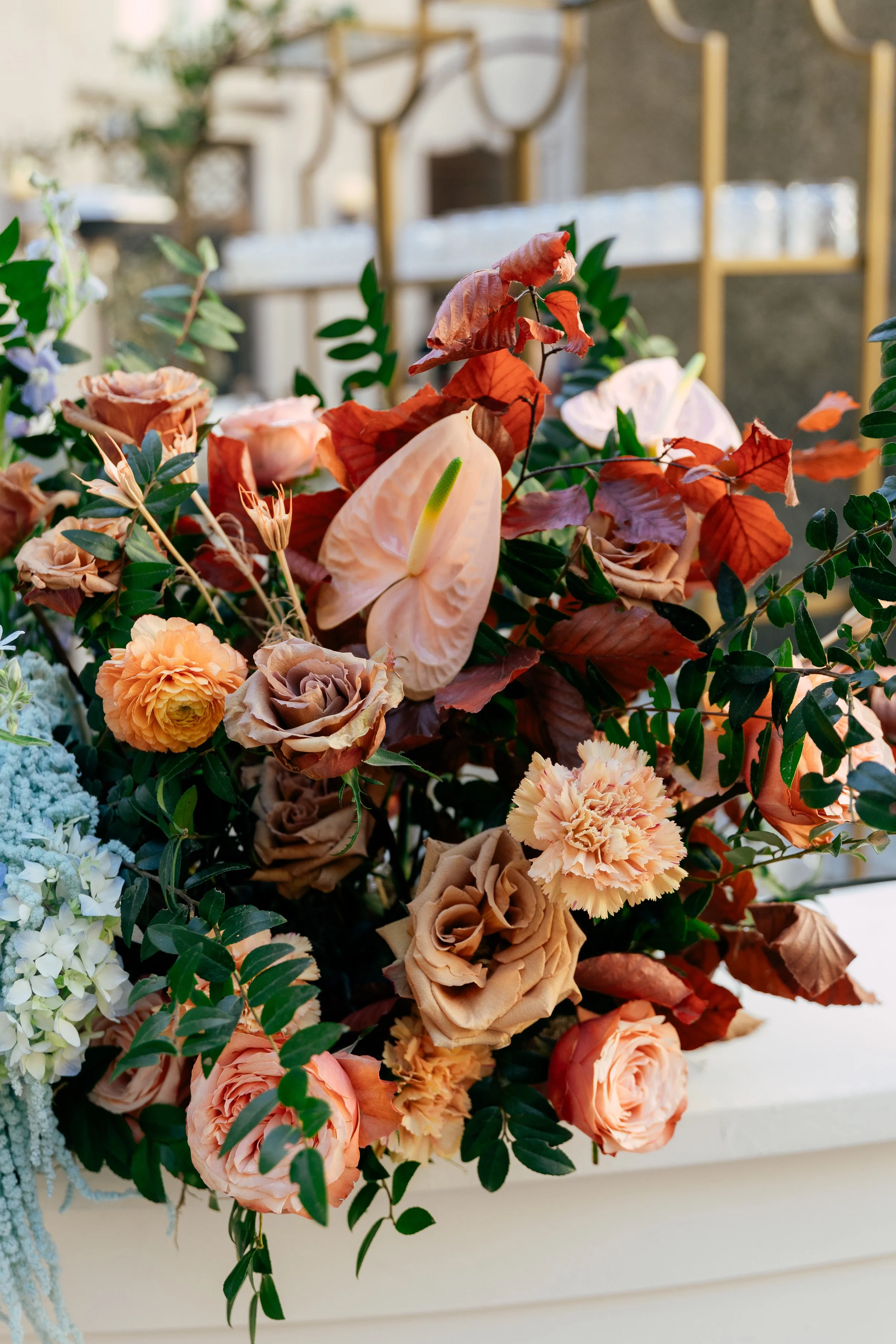 Bright and colorful arrangements create an inviting scene for guests at the TPAC Gala in Nashville Tennessee. Florals composed of roses, hydrangeas, tulips, snapdragons, dried palm, and anthurium. Designed by Rosemary and Finch.