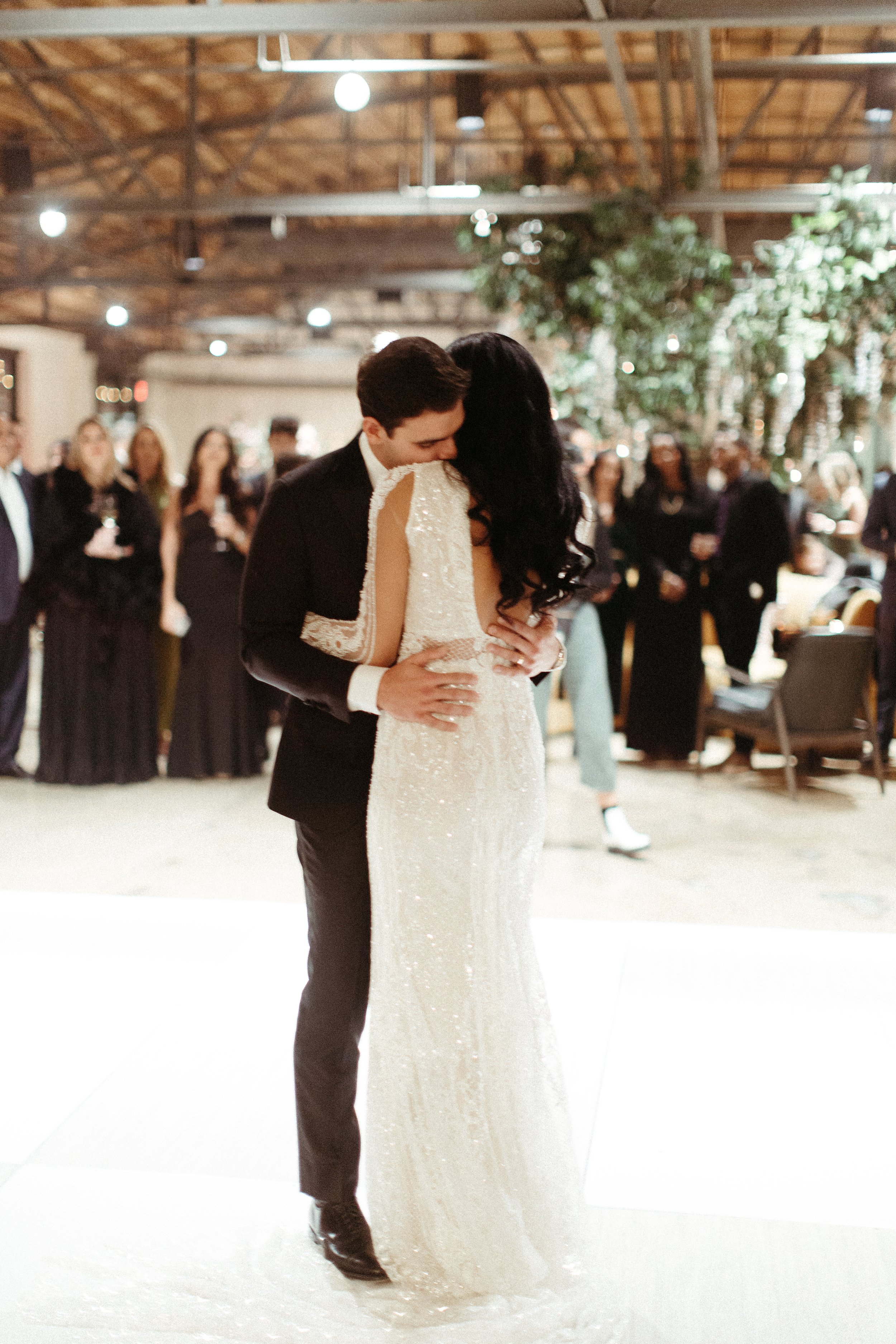 Stunning floral installations bring warmth to this Great Gatsby inspired wedding with florals of terra cotta, dusty pink, and burgundy hues. Petal heavy roses, wisteria, copper beech, and pink pampas grass accents. Designed by Rosemary and Finch in N