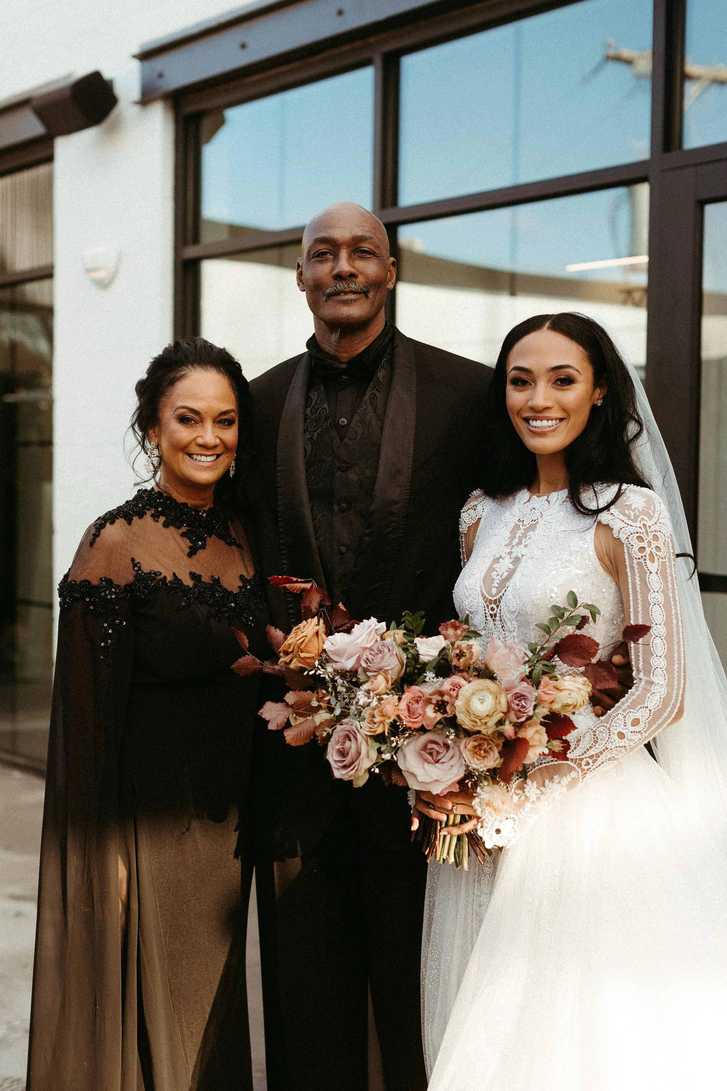 This elegant bridal bouquet brought hues of mauve, dusty pink, cream, burgundy, and terra cotta to this winter wedding. Lush with petal heavy roses, ranunculus, spray roses, copper beech, and greenery. Designed by Rosemary and Finch in Nashville, TN.