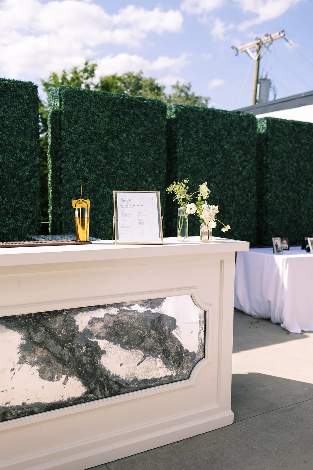 Classic white, cream, and blush wedding flowers. Florals composed of roses, ranunculus, Queen Anne’s lace, and greenery. Designed by Rosemary and Finch in Nashville, TN.