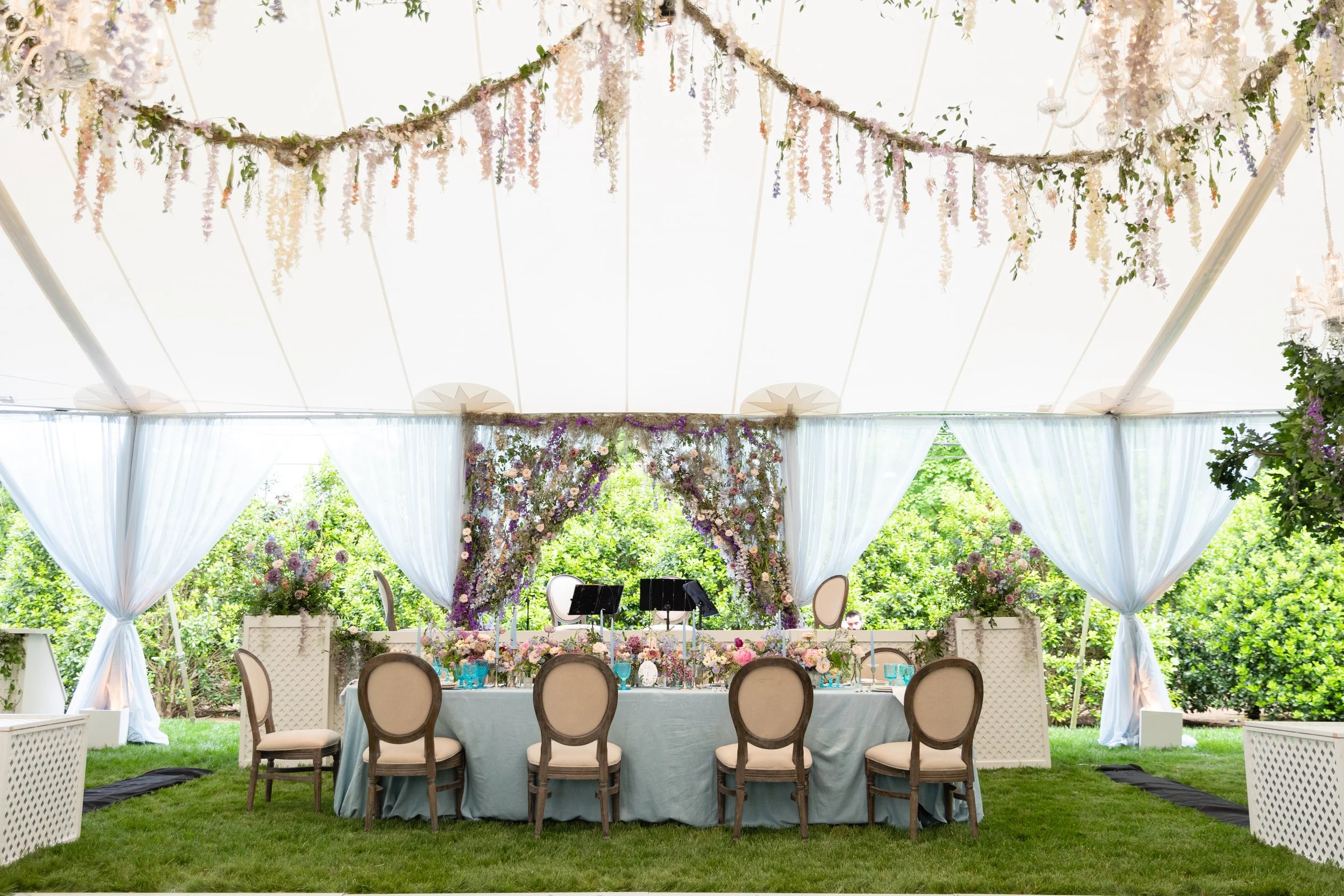 Bridgerton inspired engagement party at a private home in Nashville, TN with lush, organic floral installations of wisteria, spanish moss, and pastel blooms. Nashville wedding floral designer, Rosemary & Finch.