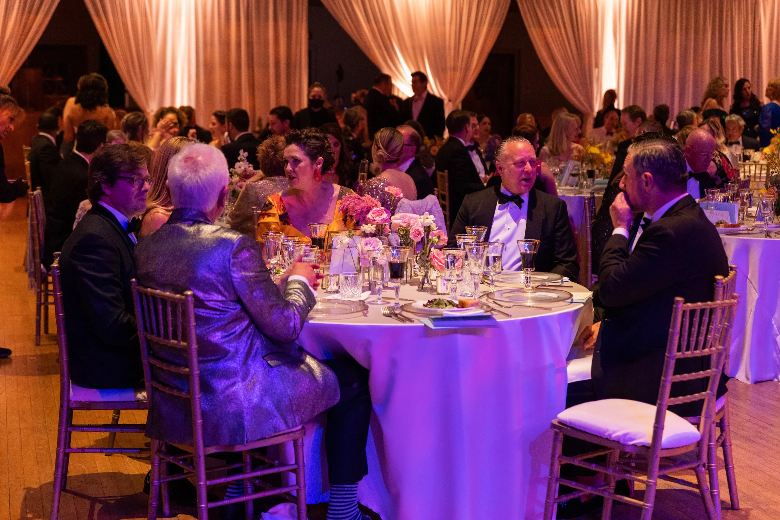 Modern and colorful centerpieces create a lively space for the TPAC Gala in Nashville, TN. Color-blocked floral hues of pink, red, yellow, blue comprised of roses, hydrangeas, tulips, ranunculus, pampas grass, carnations, and sweet peas. Designed by