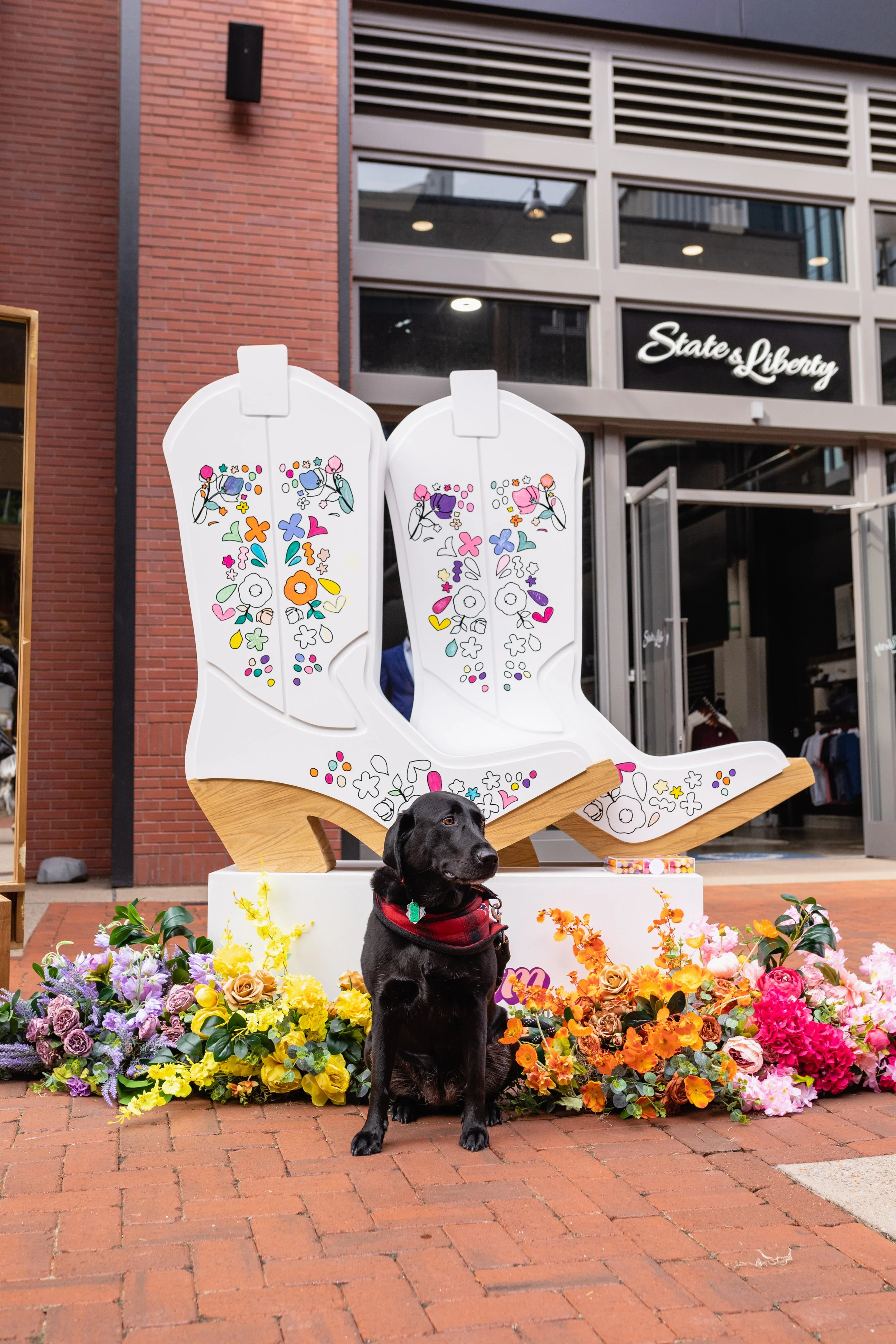 Vibrant floral installations composed of silk floral hues in pink, magenta, lavender, coral, orange, yellow, and mixed greens bring to life this spring Fifth + Broadway event in Nashville, TN. Design by Rosemary and Finch.