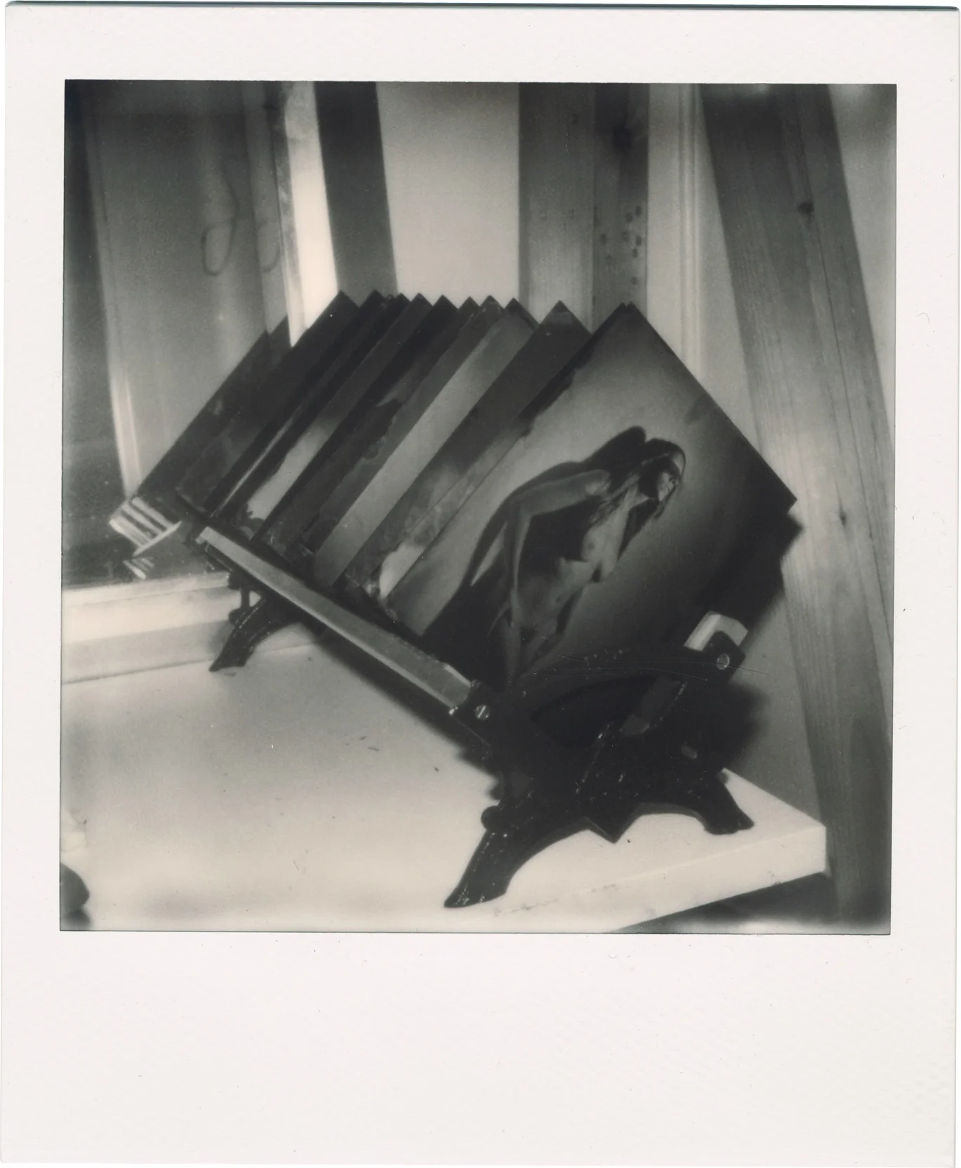 The plate rack. Black and white Polaroid.