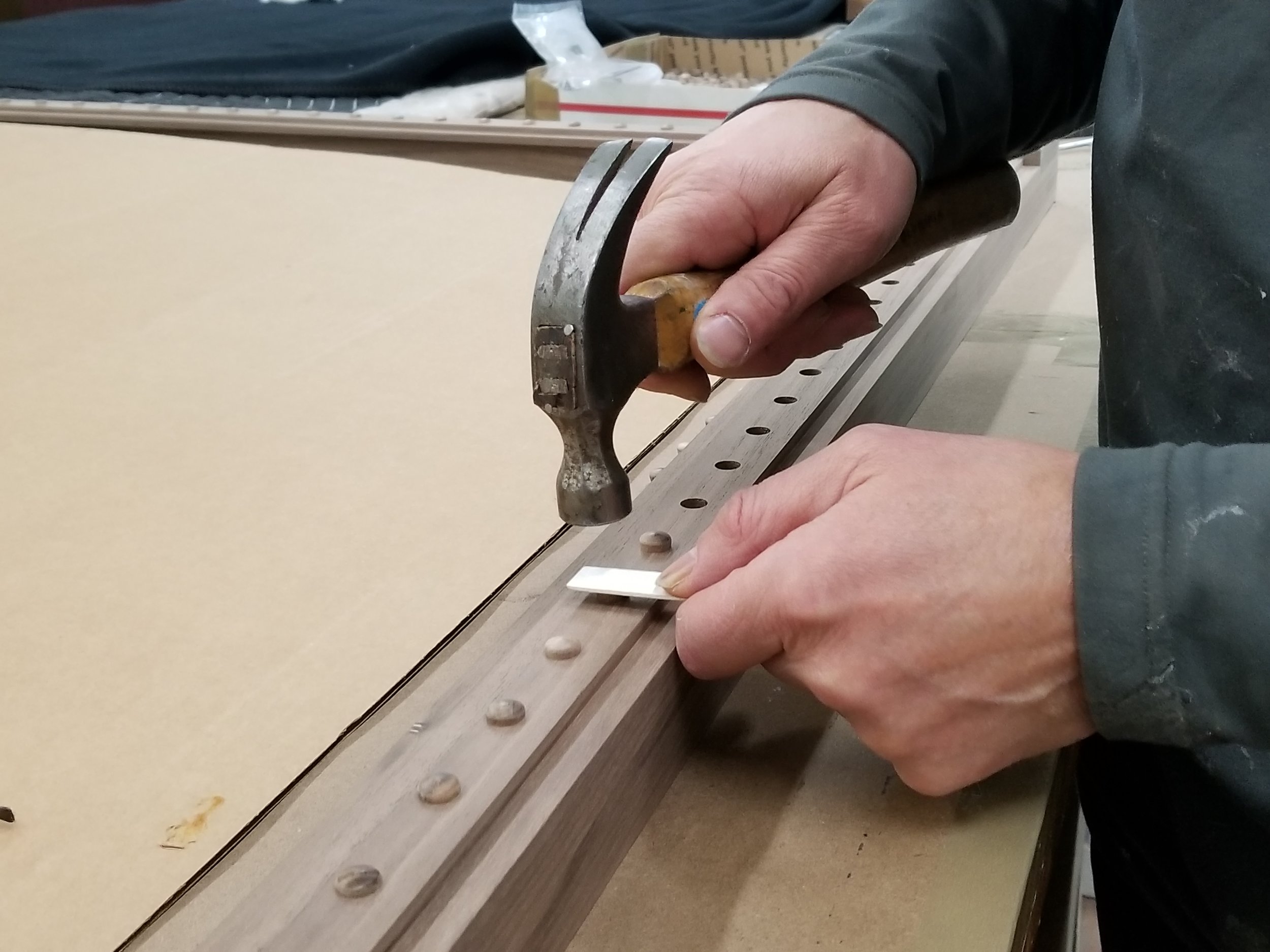Applying Walnut Pegs by Hand, Handcrafted Picture Frames.jpg