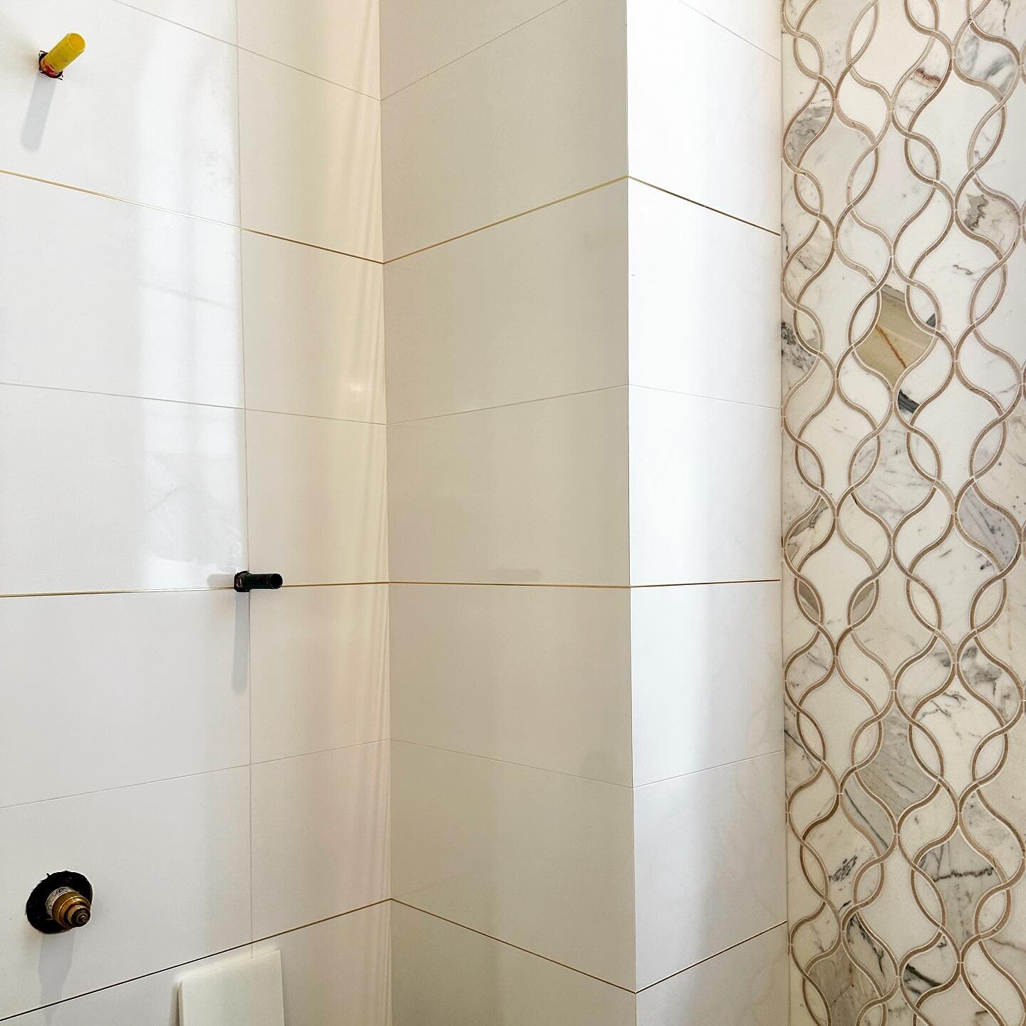 It&rsquo;s the small details that make all the difference. Brushed brass metal between every other horizontal run of tile gives the shower just that extra luxe feel. #itsallinthedetails #interiordesign #southfloridadesign #bathroomdesign