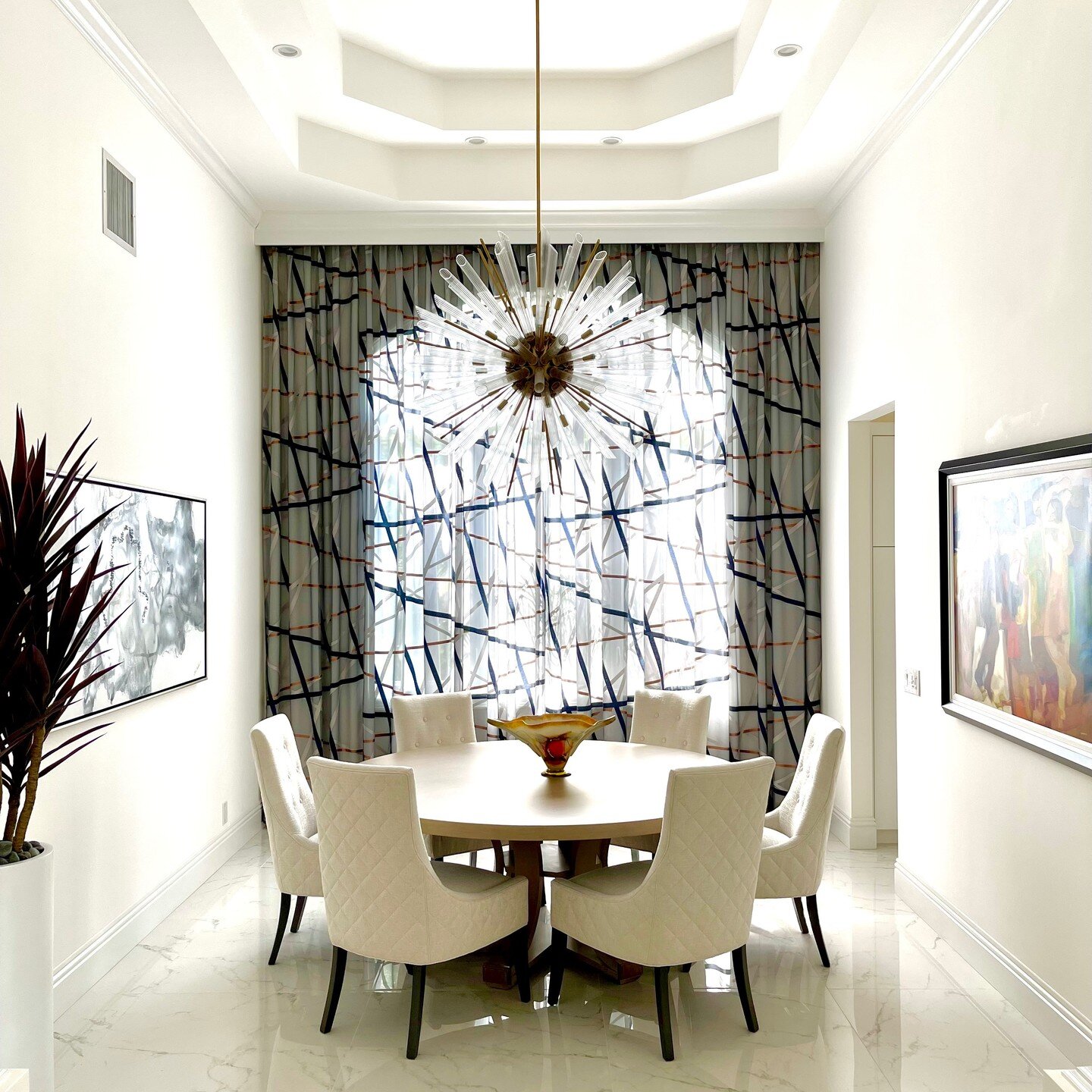 I love how this dining room came out. A wall of drapery (double sheer to help block out bright sun) gives the window wall a beautiful texture and pattern. @harlequinfw @vanguardfurniture #diningroom #diningroomdecor #interiordesign #southflorida #flo