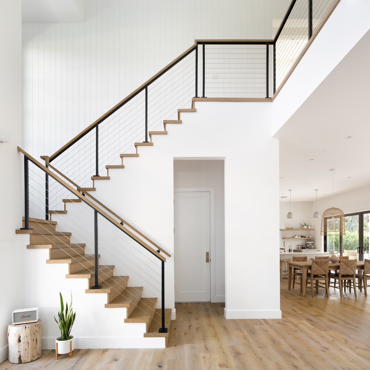 Stairs often don't need more than just a beautiful structure about them to make them special. This one is a perfect example. Doesn't need a bunch of art on the walls or other stuff getting in the way of a simple riser/tread structure and a stunning n