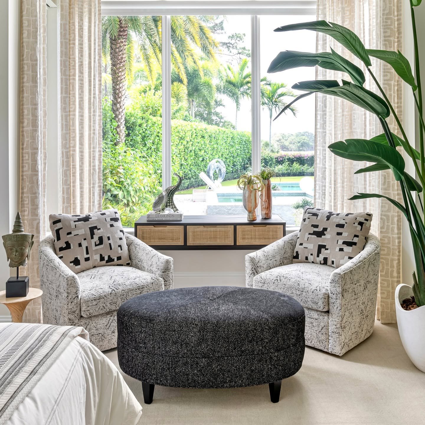 I love creating luxurious sitting areas in primary bedrooms. This one is no exception - beautiful global-inspired fabrics and comfortable seating are perfect for quiet moments at the end of a hectic day. #interiordesign #luxuryhomes #southfloridalivi