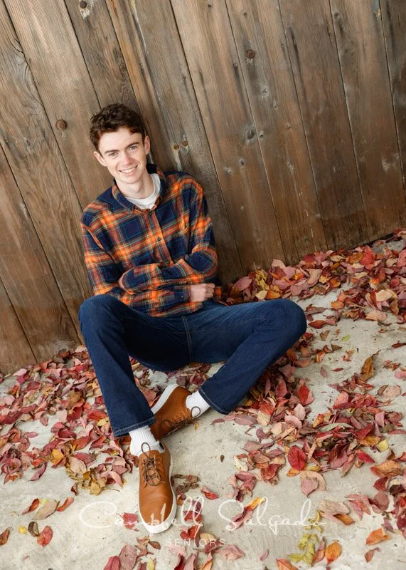  Portland senior pictures, portrait of teen on a barn doors background by high school senior photographers at Campbell Salgado Studio in Portland, Oregon. 