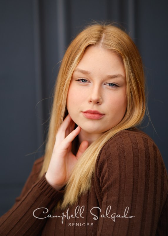  Portrait of young woman against Portland Parlour background by Portland senior picture photographer Kim Campbell of Campbell Salgado Studio in Portland, Oregon. 