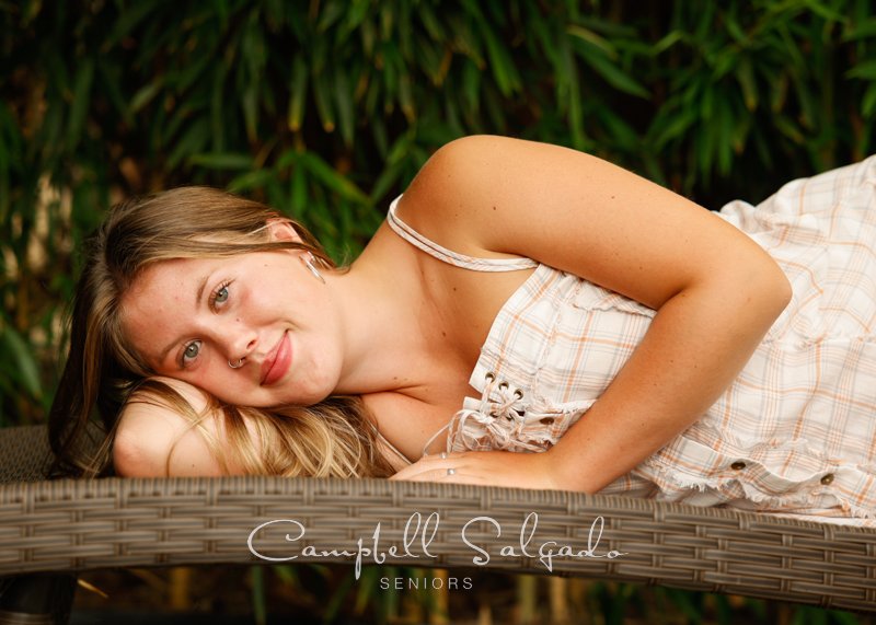  Senior picture of a young woman on a bamboo background by high school senior portraits photographers at Campbell Salgado Studio in Portland, Oregon. 