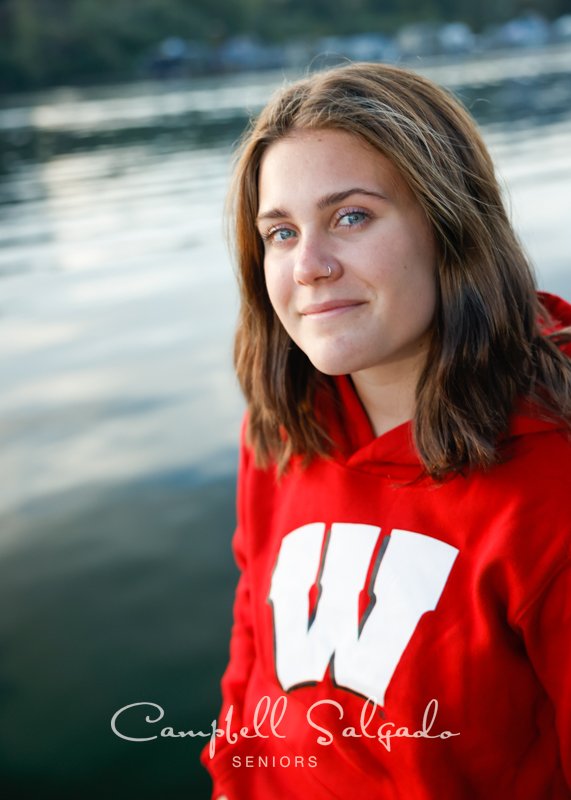  Senior picture of a young woman in river background by high school senior portraits photographers at Campbell Salgado Studio in Portland, Oregon. 