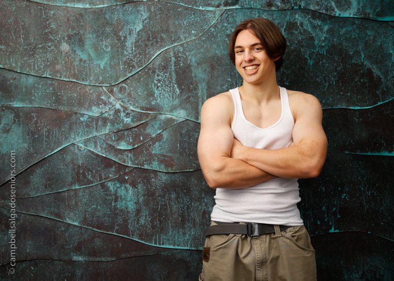  Portrait of young man against an ocean weave background by Portland photographers - senior pictures at Campbell Salgado Studio in Portland, Oregon. 