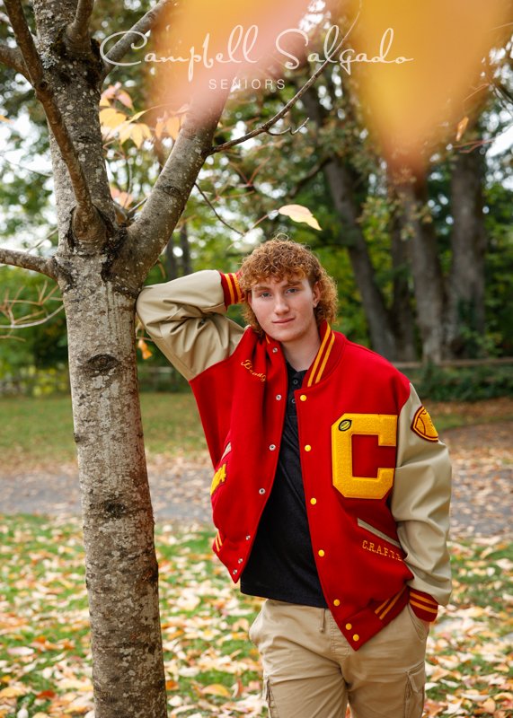  Portrait of young man against an outdoor background by Portland photographers - senior pictures at Campbell Salgado Studio in Portland, Oregon. 