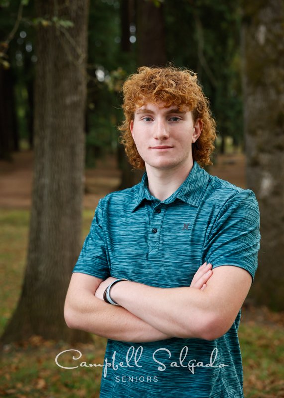  Portrait of young man against an outdoor background by Portland photographers - senior pictures at Campbell Salgado Studio in Portland, Oregon. 