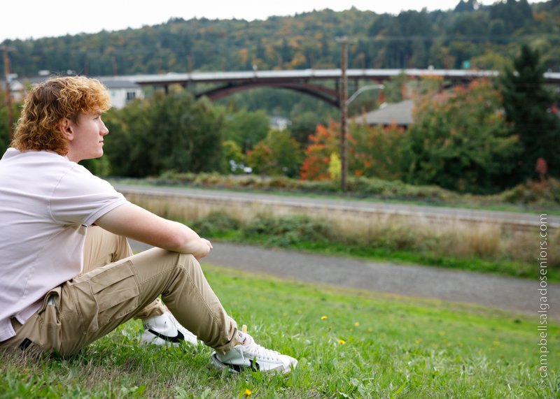  Portrait of young man against an outdoor background by Portland photographers - senior pictures at Campbell Salgado Studio in Portland, Oregon. 