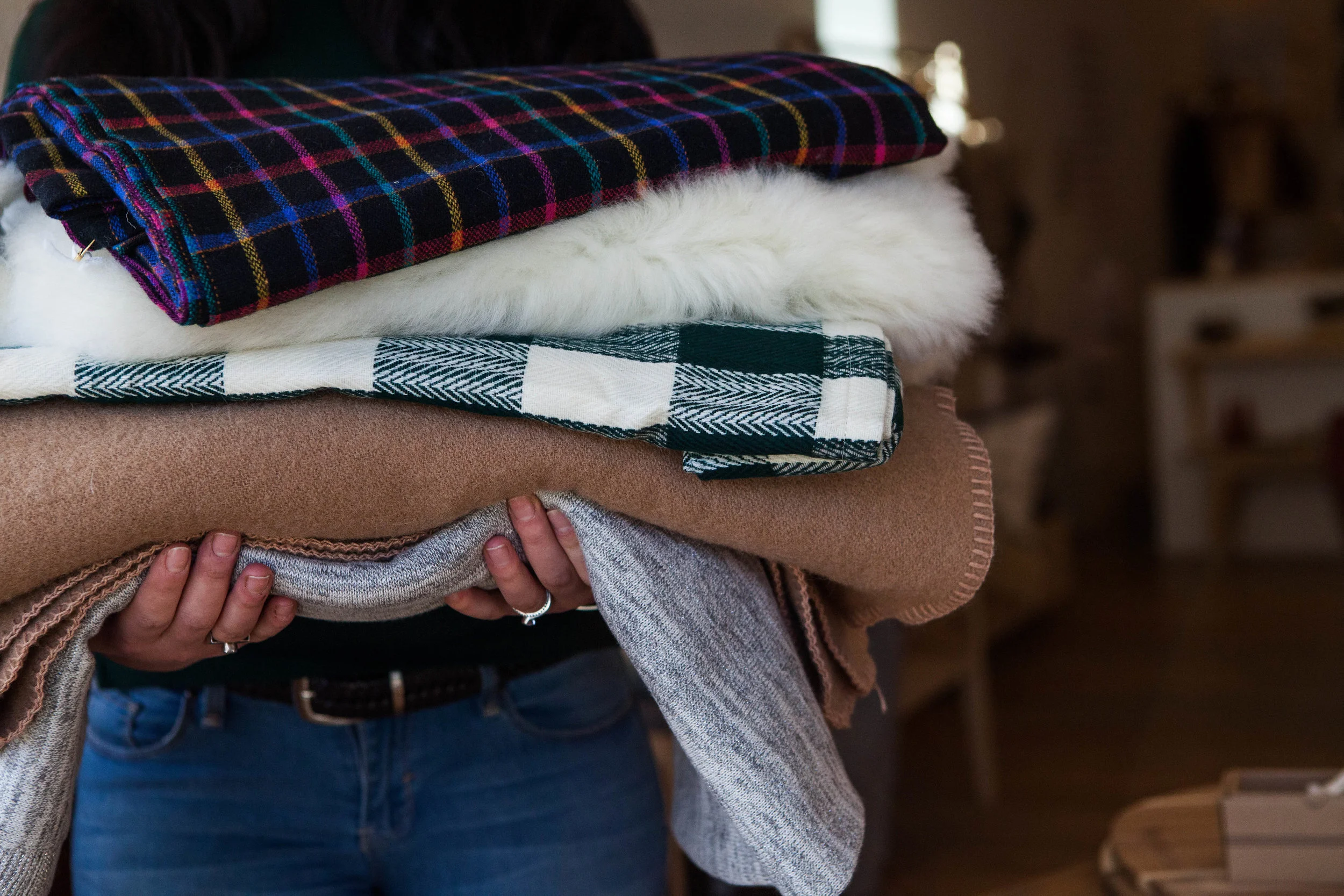 Flannel Blanket $56, Sheepskin $145, Vintage Wool Blanket $56, Surya Grey Throw $75