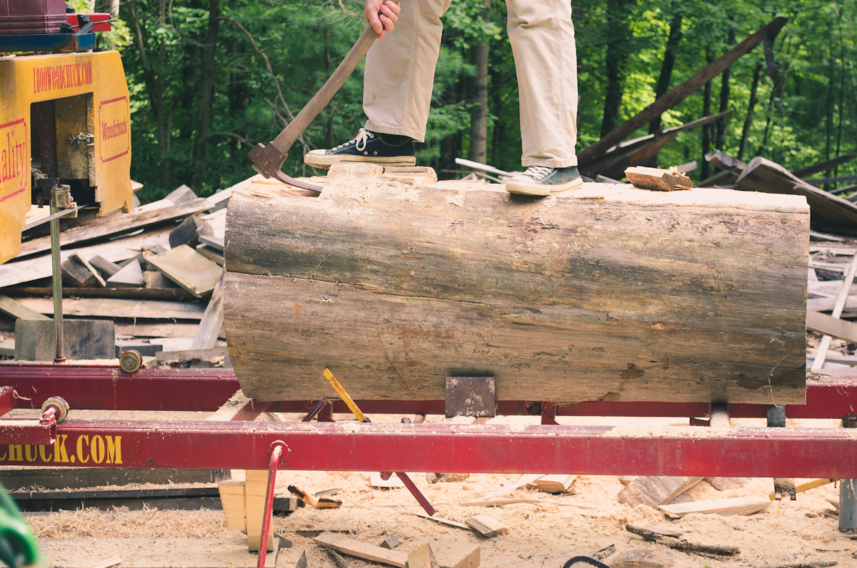 Standing on Log with Adze
