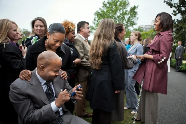 Rebuild Hope founder Dana Hendrickson awaits his opportunity to talk to our First Lady Joining Forces Anniversary Celebration - White House South Lawn - April 11, 2012