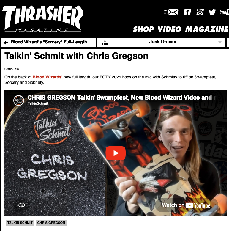Chris Gregson holding up the blood wizard fantasia series art deck on Talkin Schmit podcast