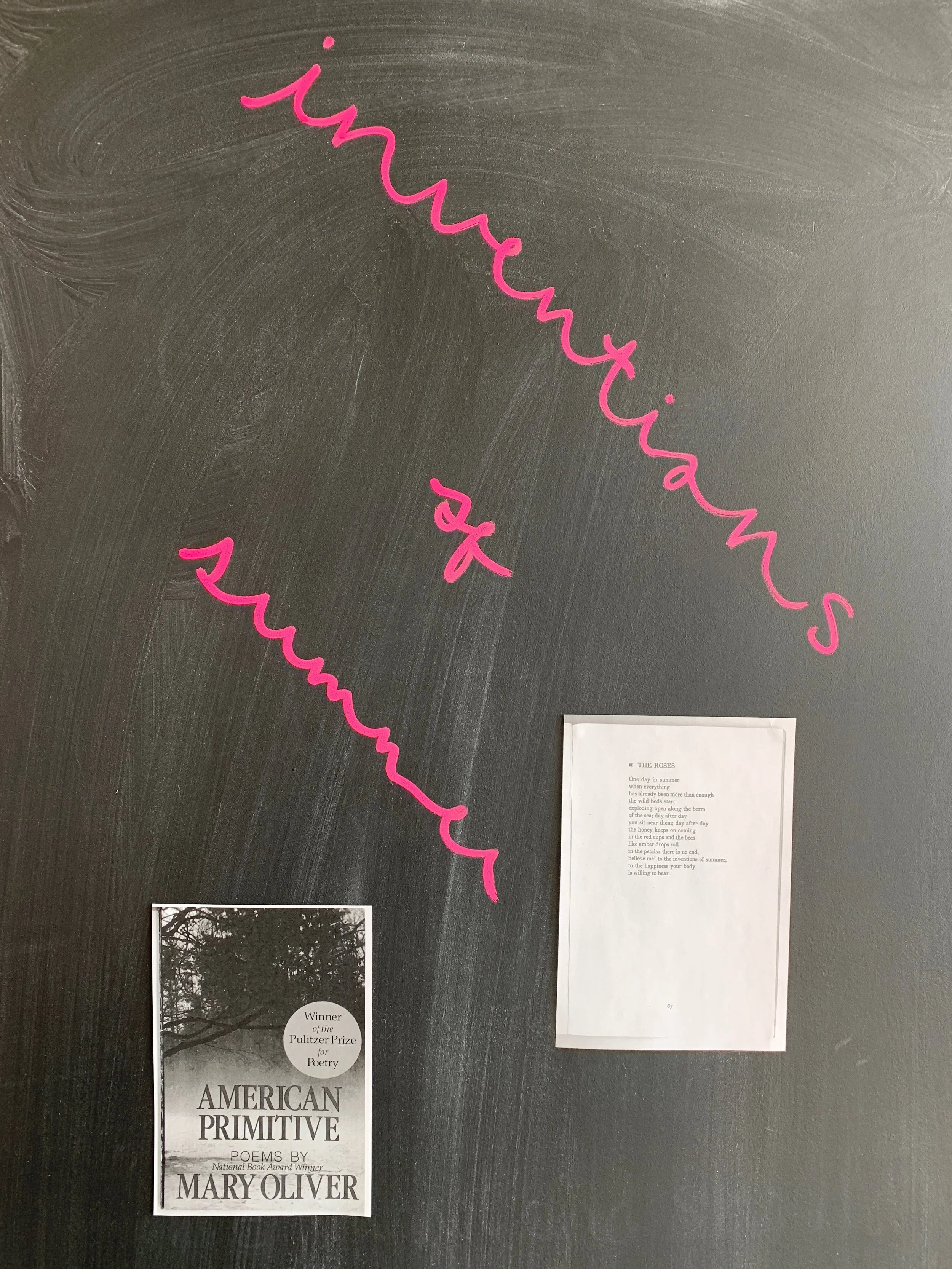 A black chalkboard with pink cursive writing 'inventions of summer'. features an image of cover of 'AMERICAN PRIMITIVE' trees and the text 'Winner of the Pulitzer Prize for Poetry' and a copy of 'the Roses' by Mary Oliver.