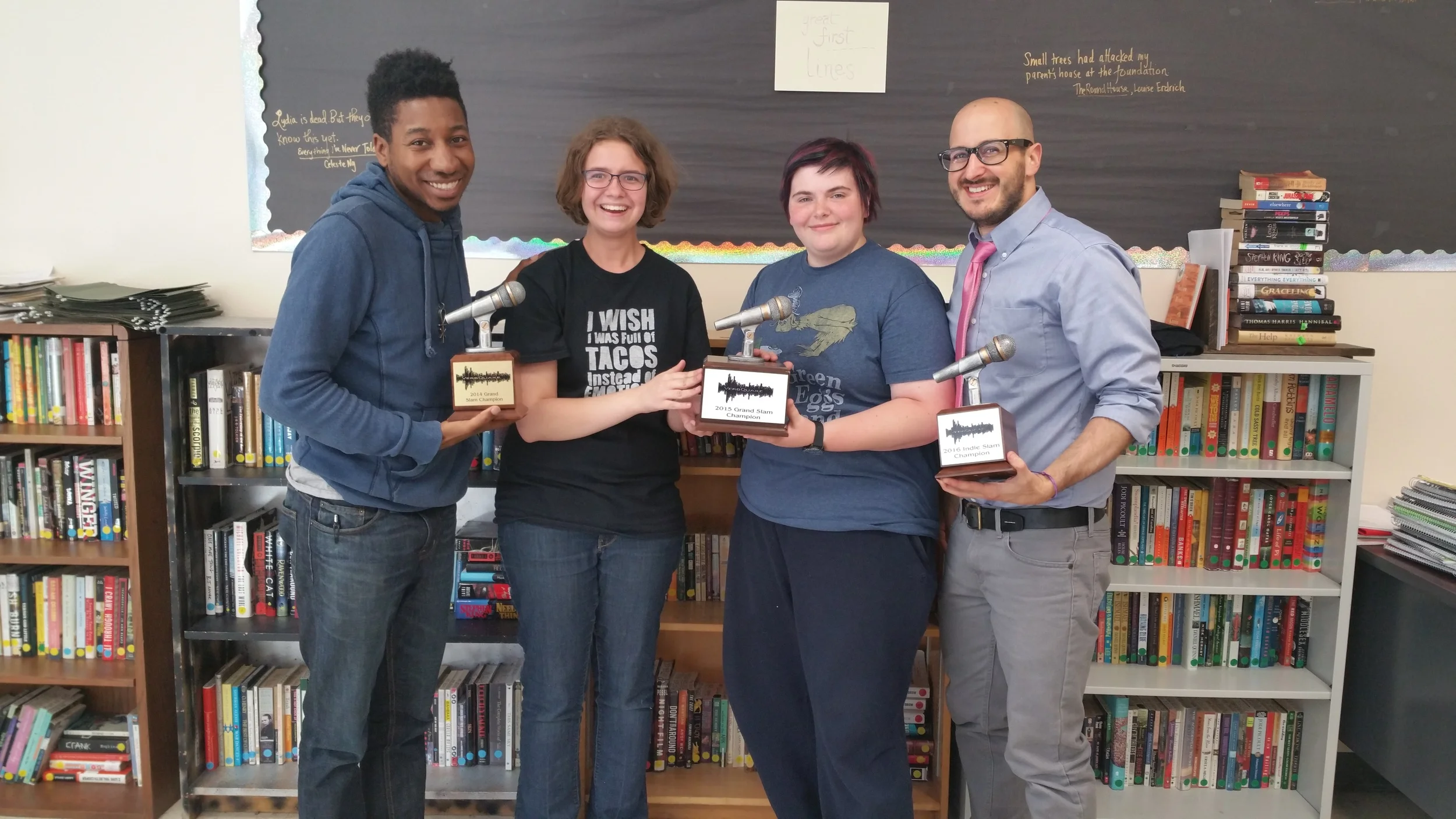 *Image of two graduated seniors from the Kirkwood High School team as well as Kirkwood High School English teacher Dominic Pioter. We are collectively holding all of the Kirkwood first place titles in succession, during my time as a teaching artist there.