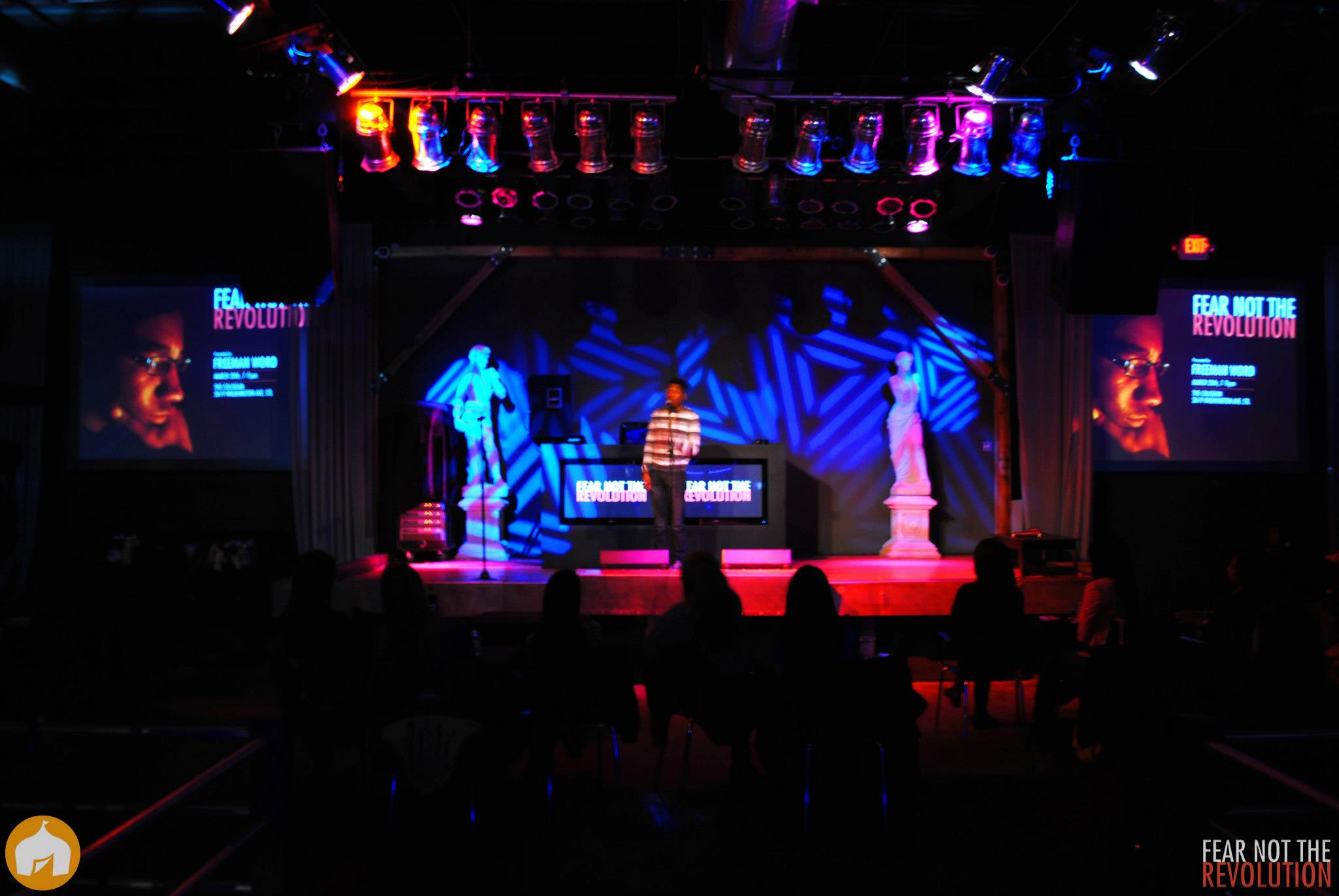 *Image of my performance/stage setup for Fear Not The Revolution - over 100 people attended to hear poetry on a Wednesday night at the Coliseum. In lieu of a senior thesis, I decided to produce, promote, and headline my own poetry show. Community activists Zaki Baruti, Melvin White, and Olajuwon Ali gave speeches. Artists Aimee Le, Gerald Jackson, Loren D, and Louis Conphliction performed.