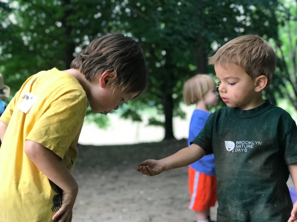 boys_outside_sharing.jpg