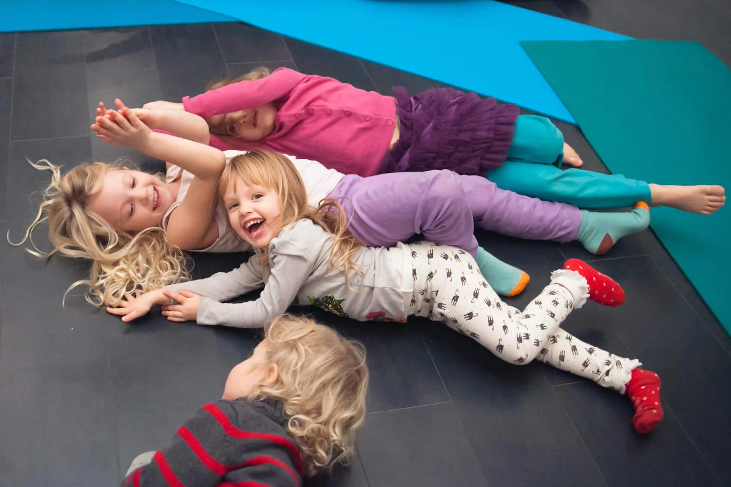Children playing and laughing on the floor