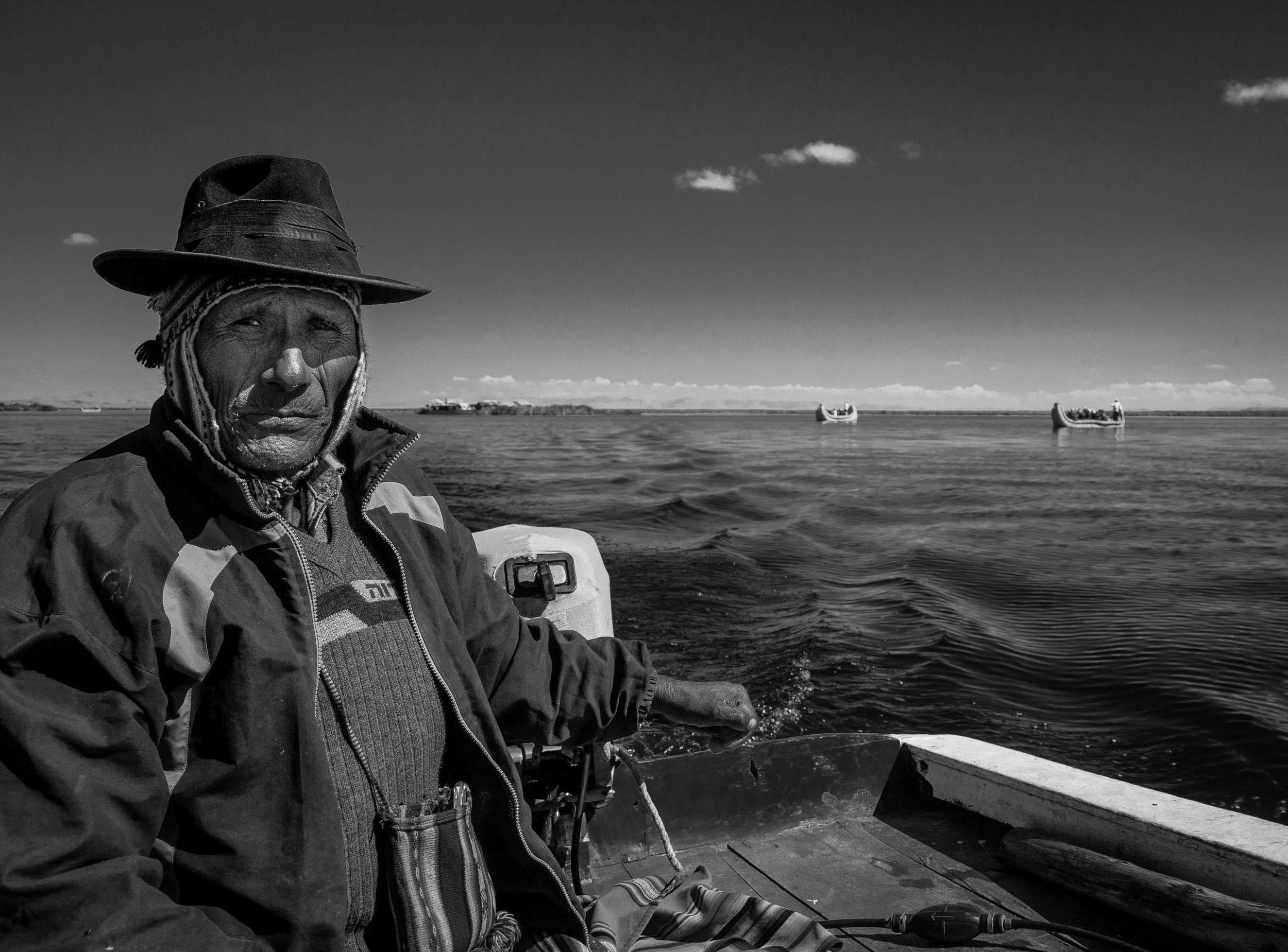 Jose, who ferried us around Lake Titicaca. Some of the traditional Uros boats can be seen in the background.
