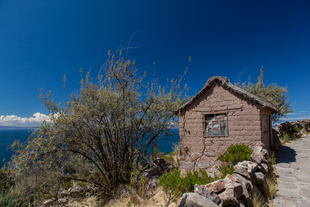 A small adobe building on the path. Probably used for storage.