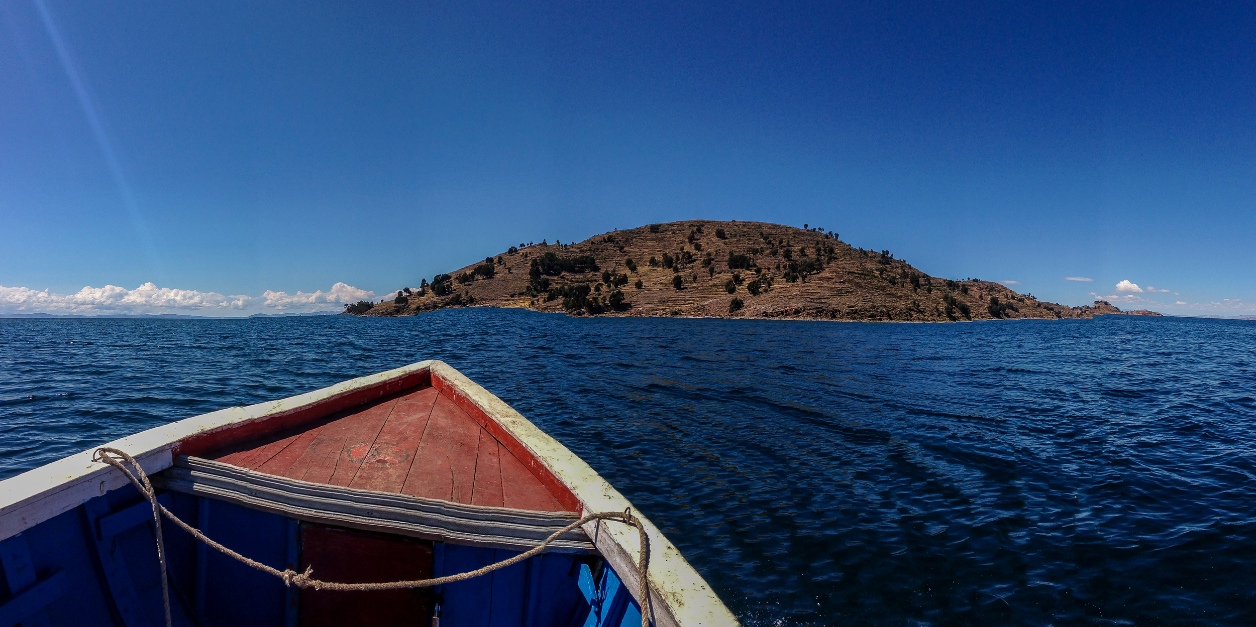 Taquile and the bow of Jose's boat. A panorama taken with my phone.