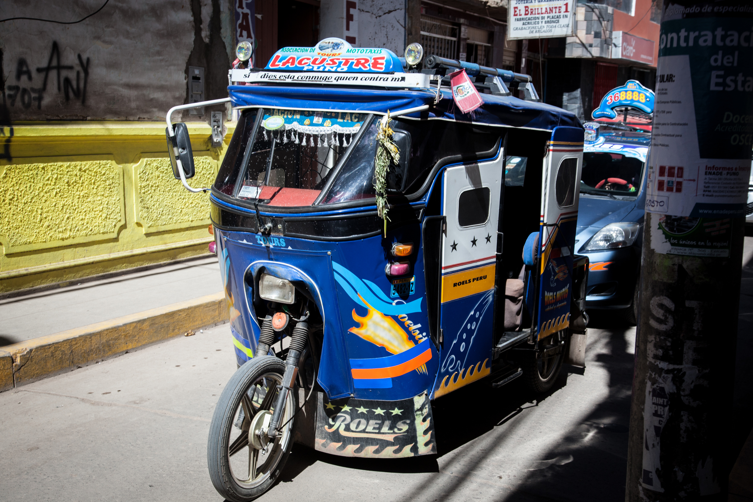 A tricolo or motorcycle rickshaw. An inexpensive and fun way to get around town.