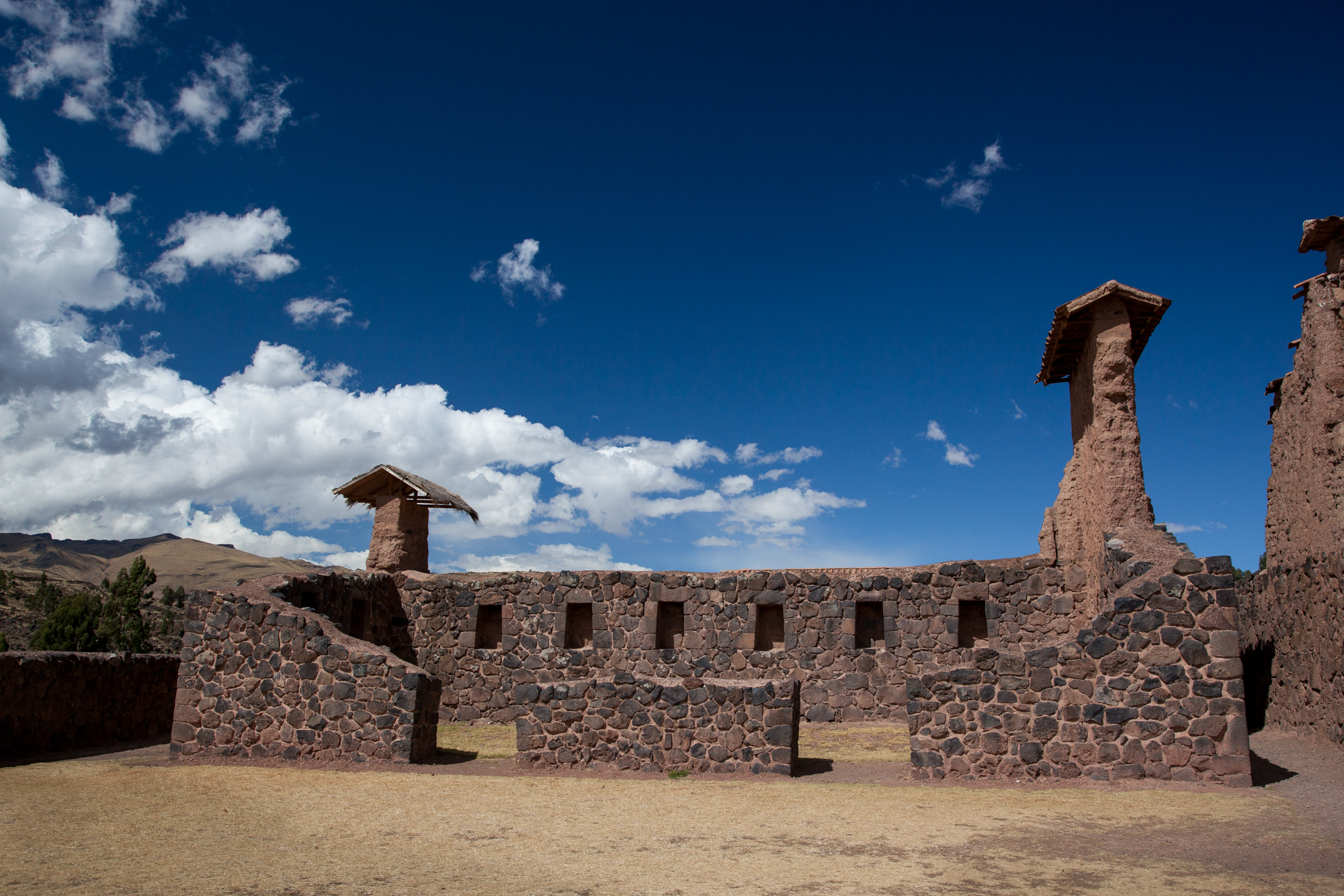 One of the buildings in the residential area. This one did not have the taller adobe wall on top any longer, but others can be seen in the distance.