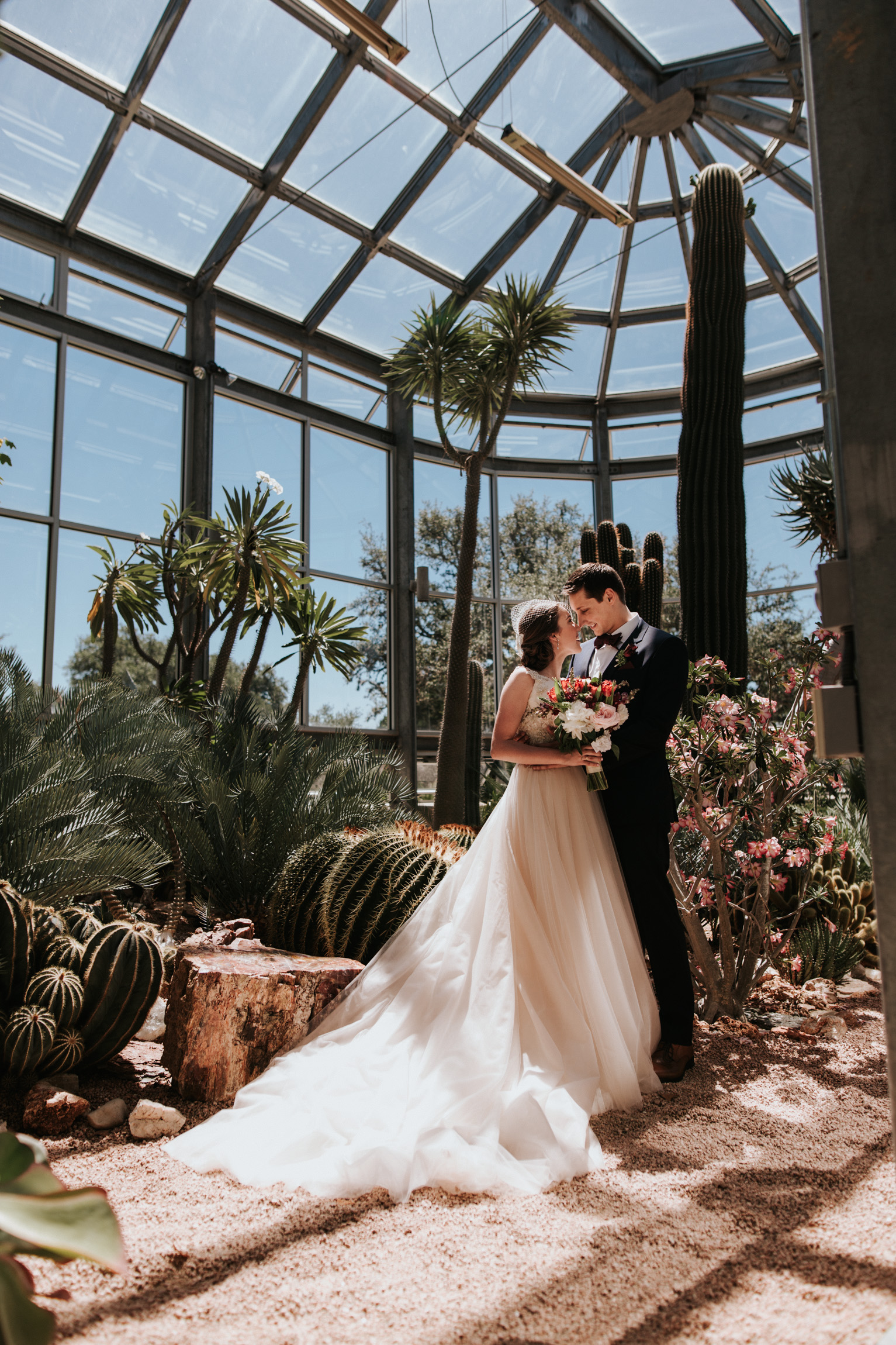 Bride and Groom inside a Greenhouse at Driftwood