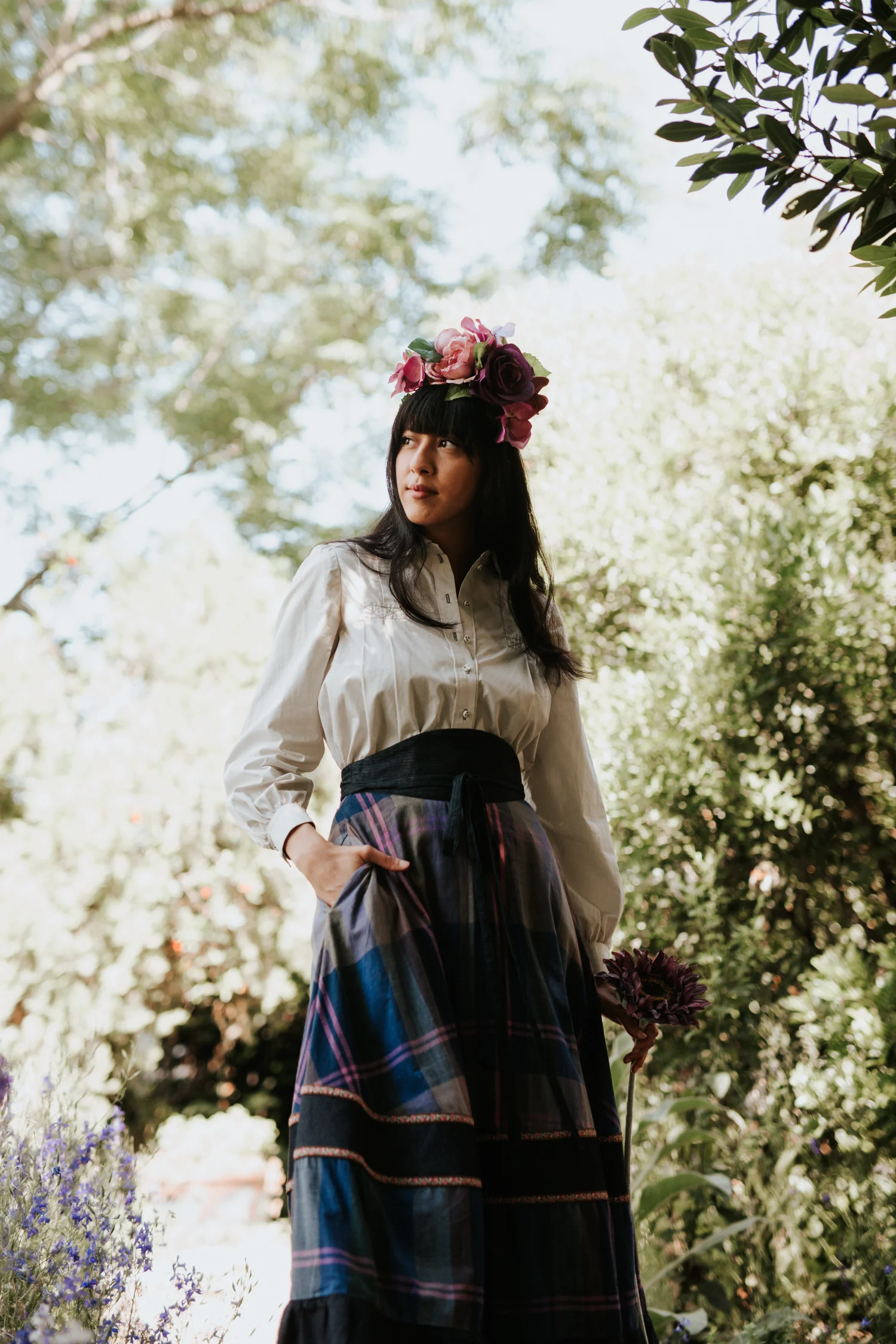 Woman in flower crown and Rat Des Champs vintage outfit