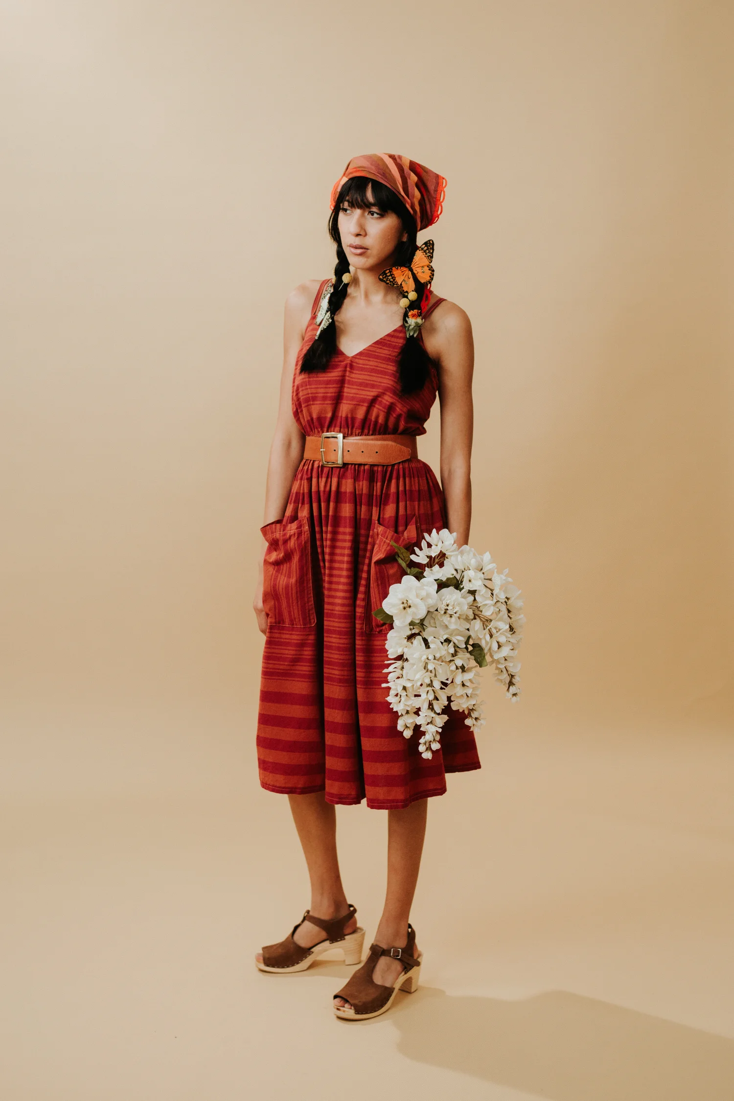 Woman in red vintage bandana and dress