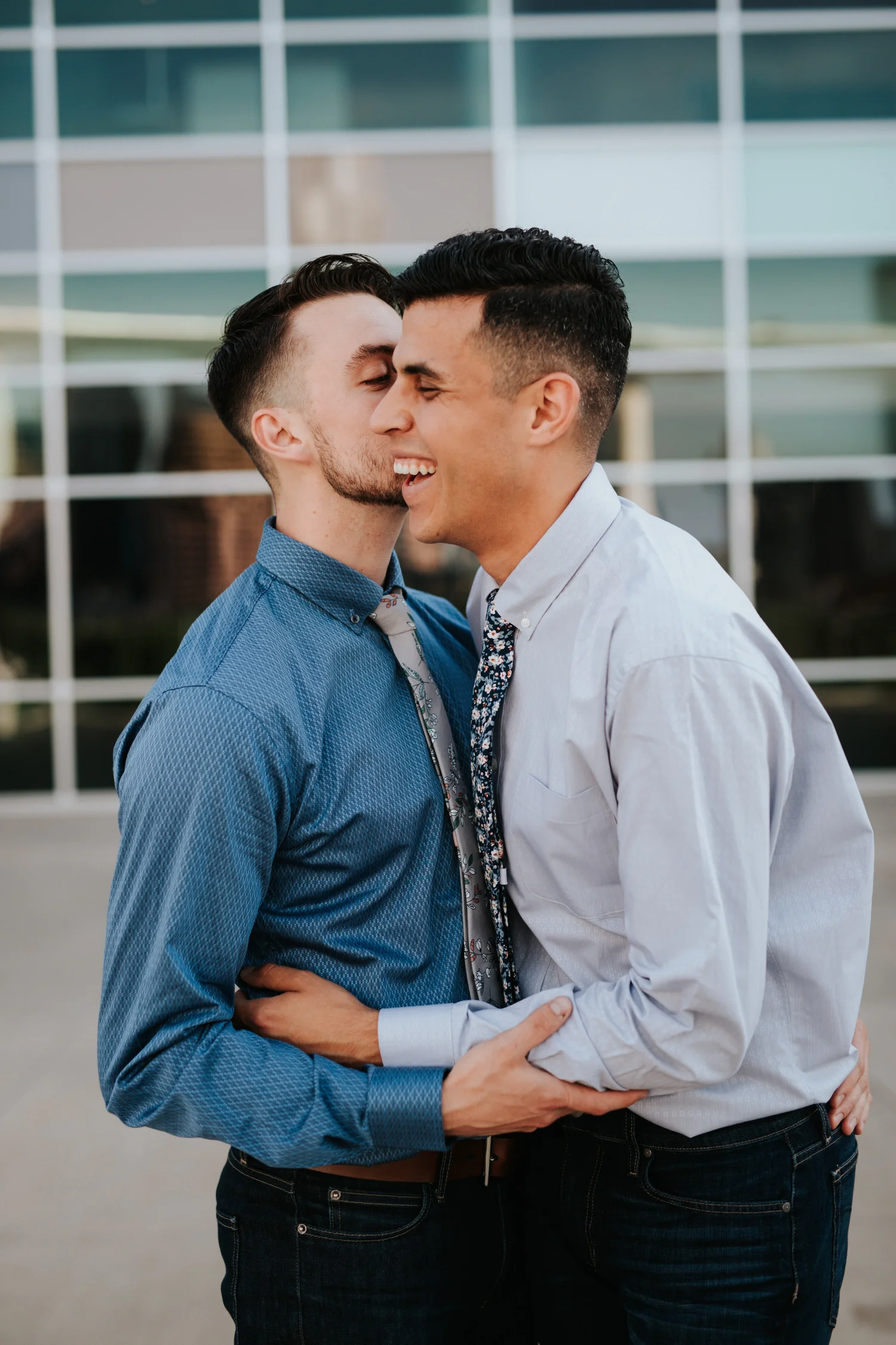 Happy engaged gay couple at The Long Center in Austin