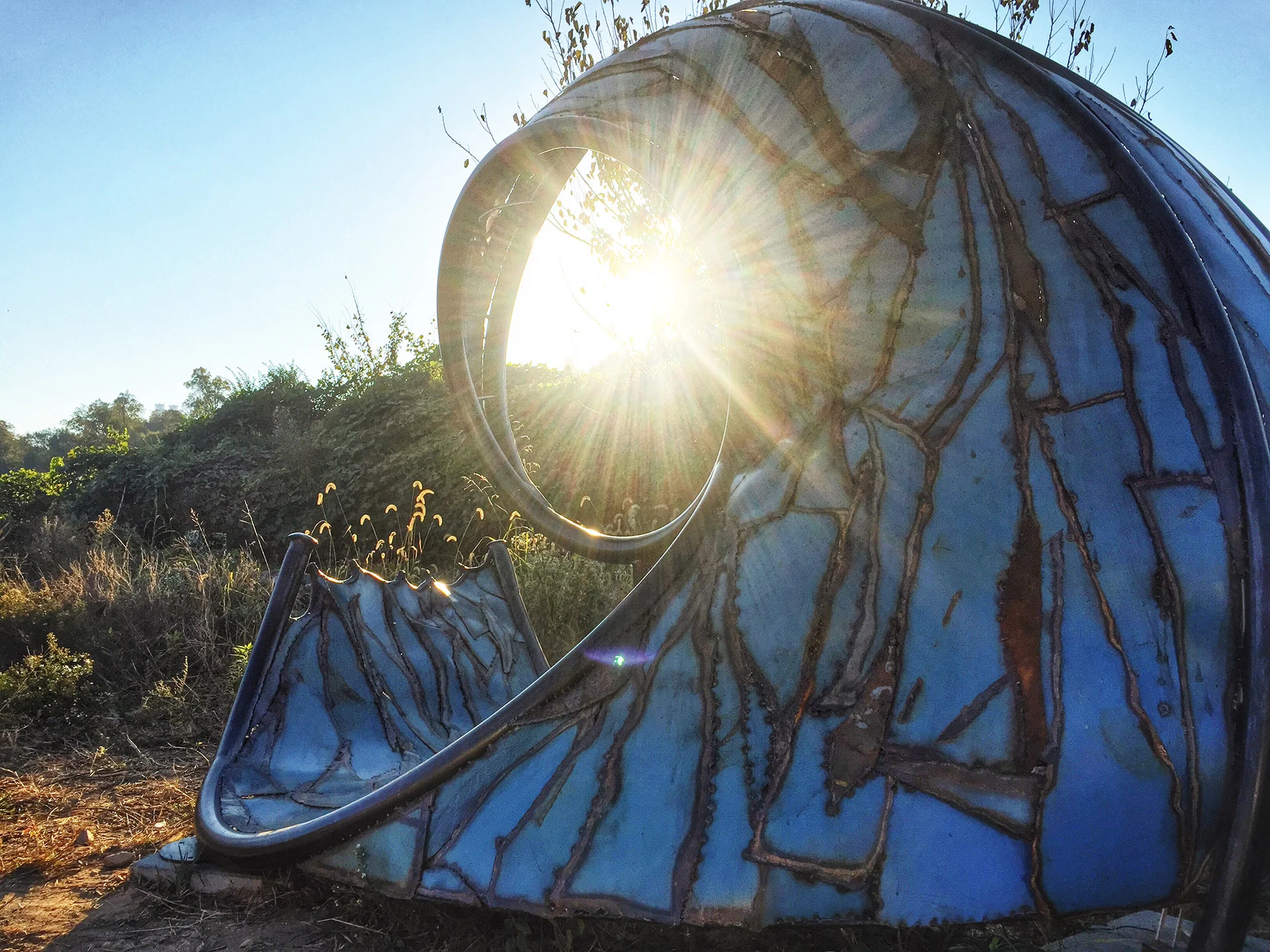 Sacred Sunset Spiral Viewing Decatur, GA, private collection, formerly on Eastside Beltline Trail 2014, recycled, forged, and fabricated steel, 8’ x 12’x 6’ (600 lbs)