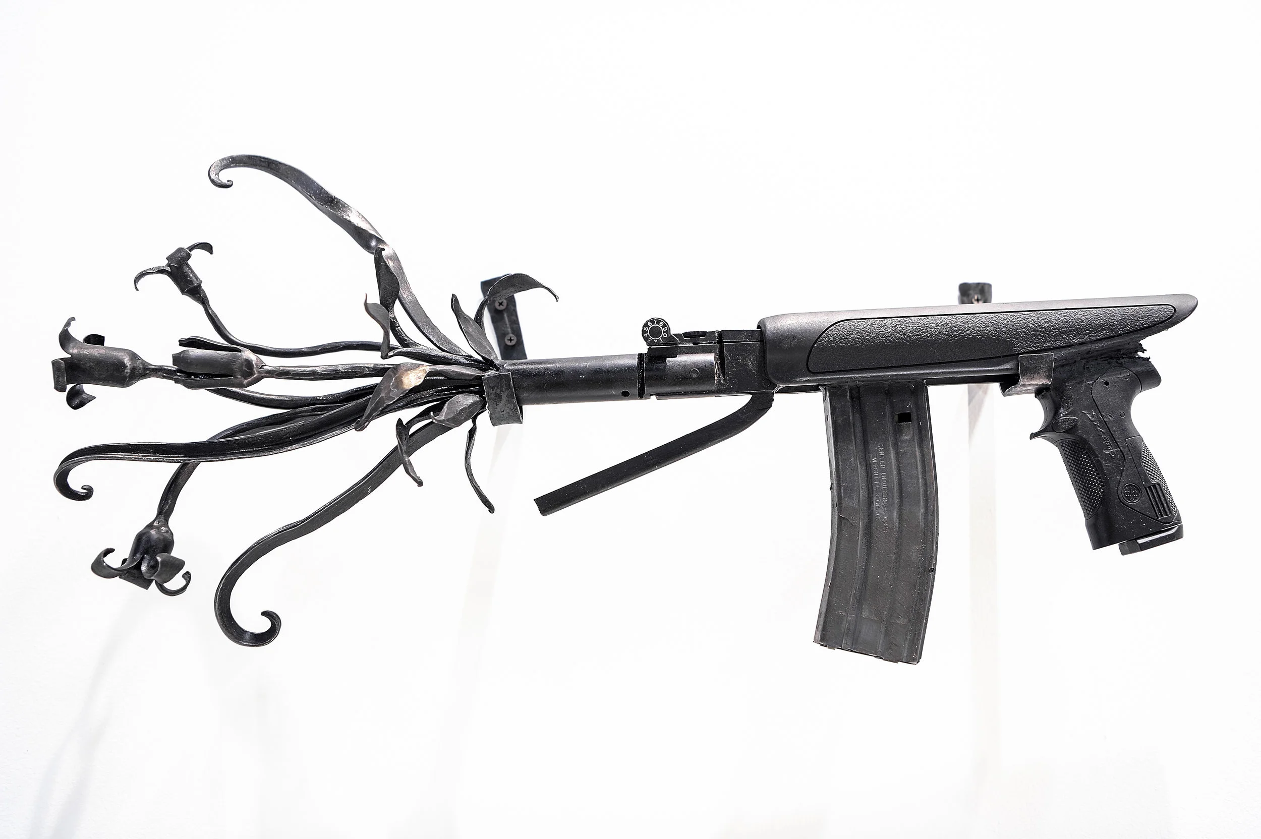 Flourish , 2019, recycled guns and gun barrels, forged steel, 13.5” x 28” x 5”