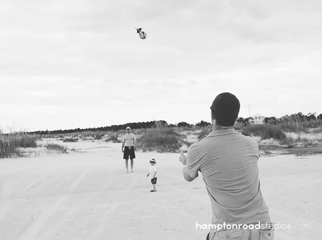 bw matt catching football on beach