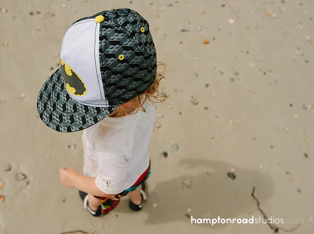 p overhead on beach with batman hat
