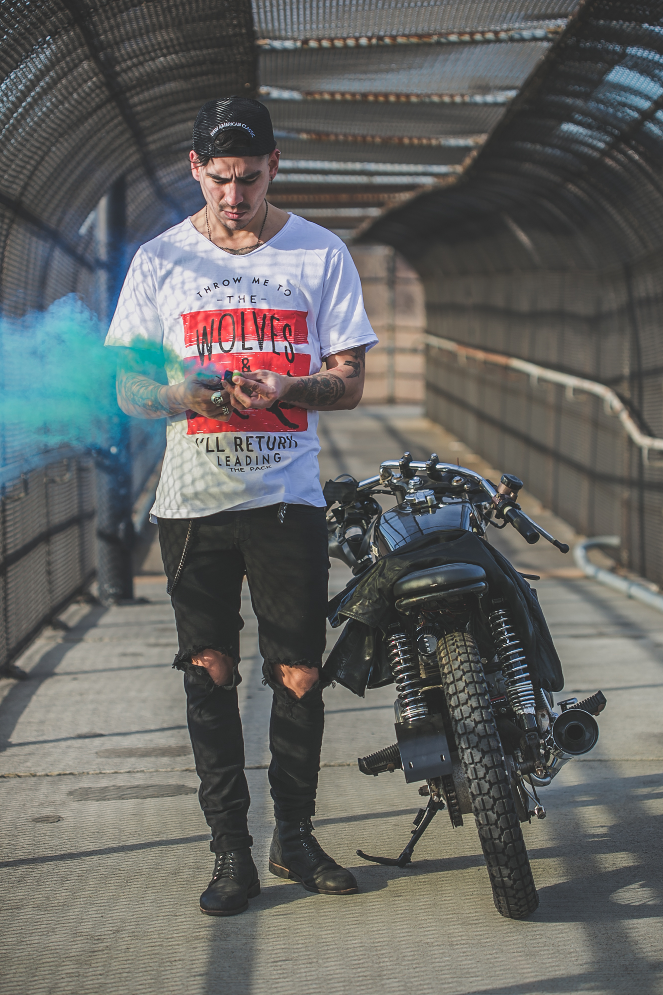 tattooed model in Anchored Apparel with motorcycle