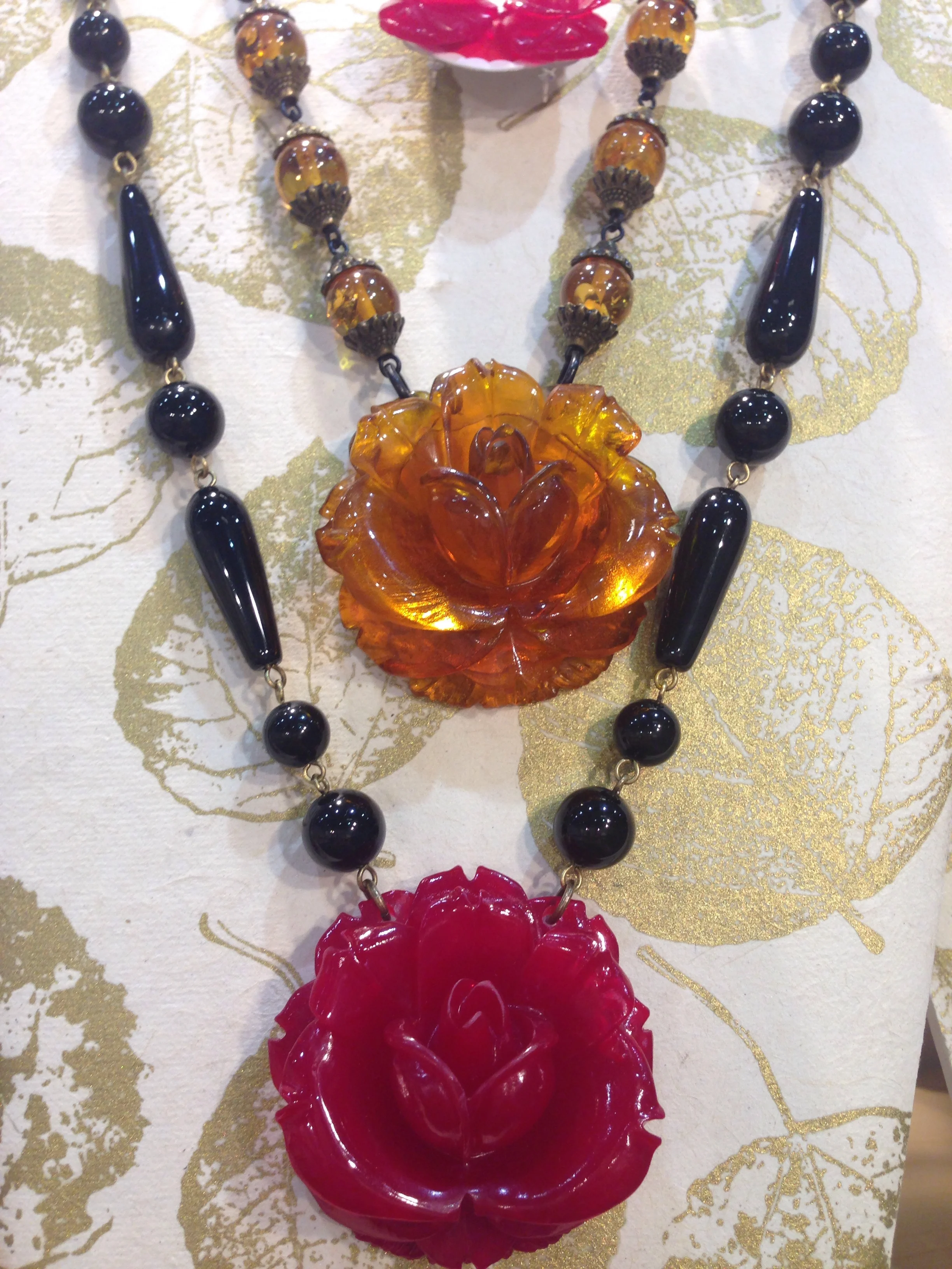 Roses! Big roses! Paired with black onyx and amber. Really nice! 