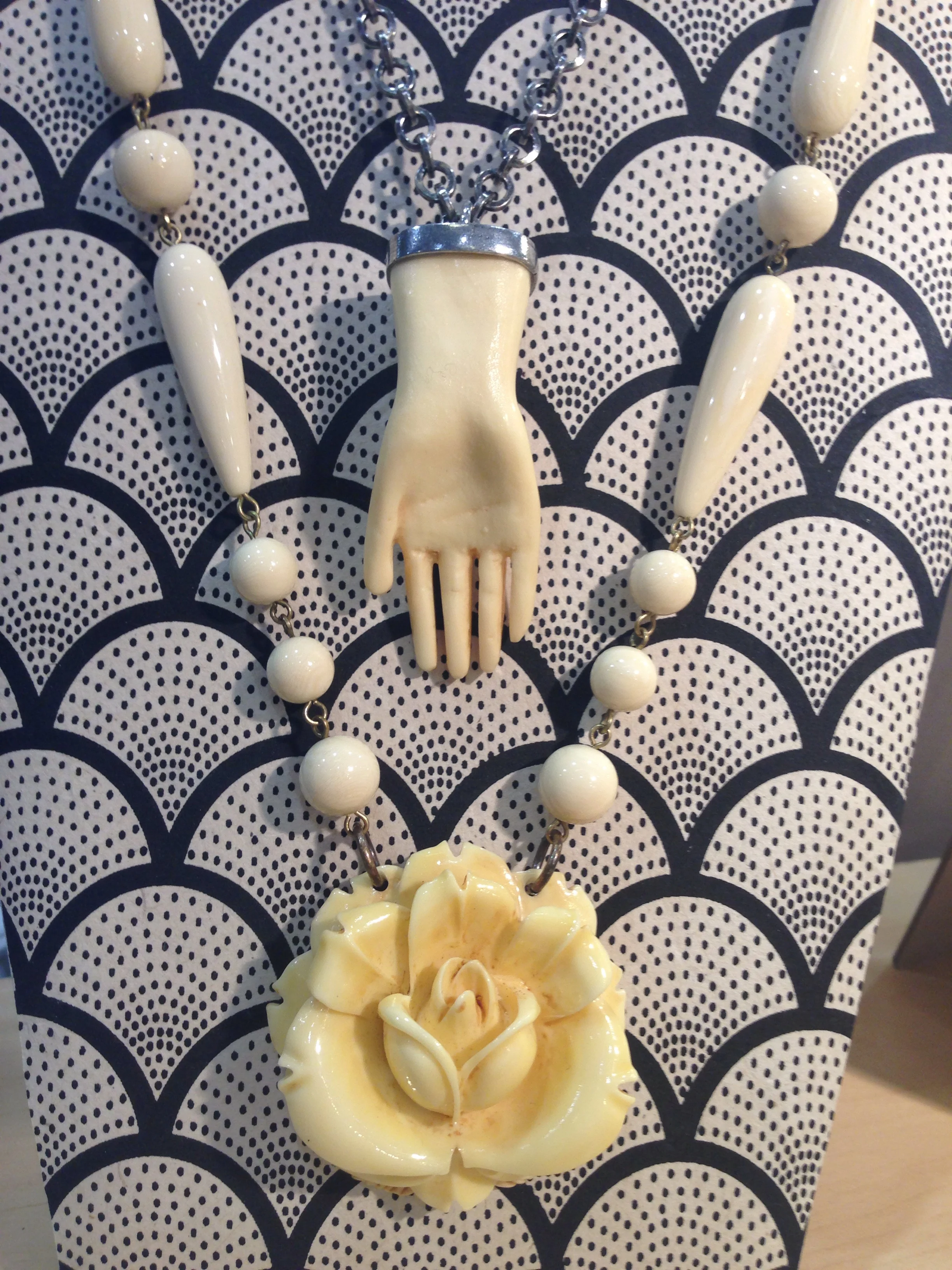 Saint's hand on antique silver chain. Bone rose, beaded. Very vintage. 